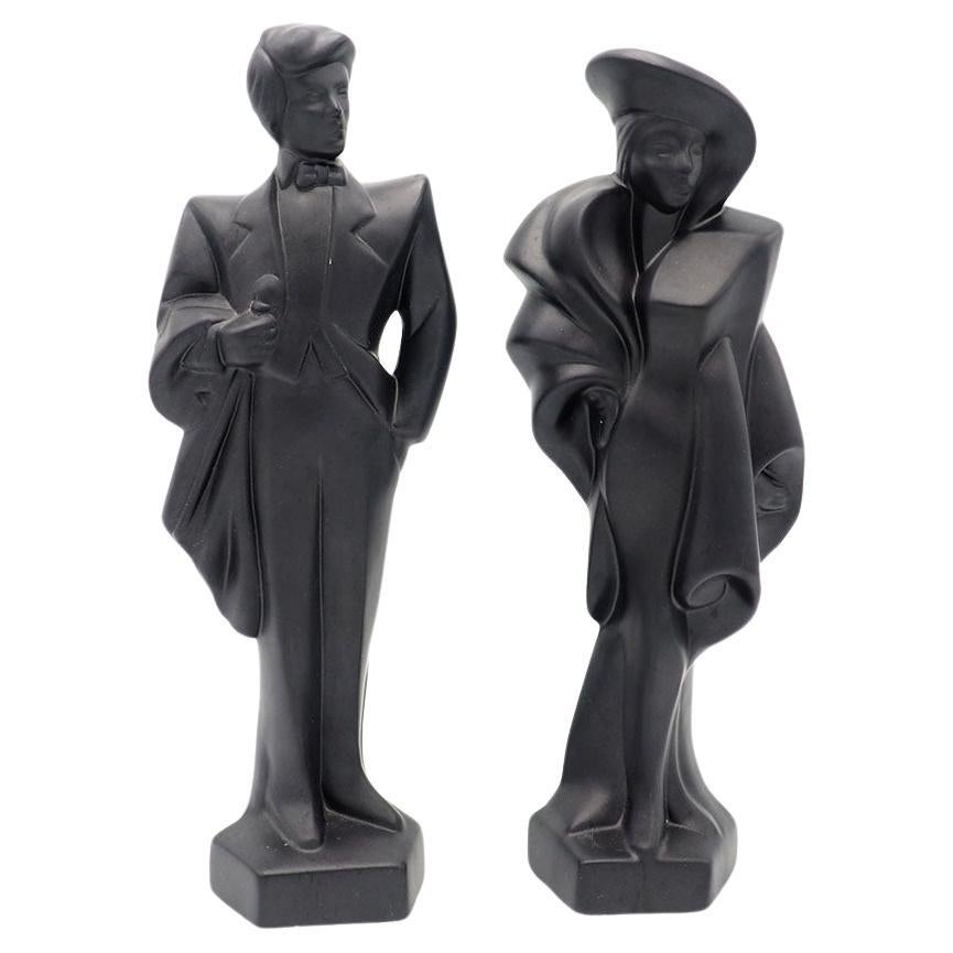 1980s decorative art deco couple dressed in gala clothes