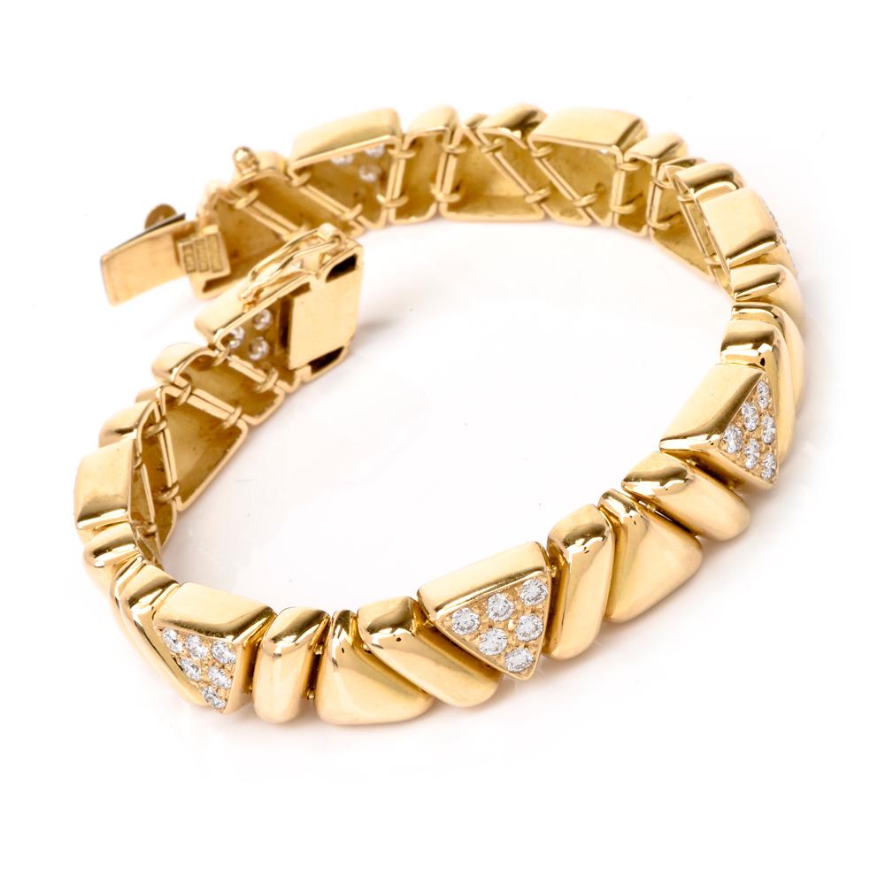 This immaculately crafted and timelessly elegant estate bracelet with pave diamonds is crafted in solid 18 Karat yellow gold, weighing 37.7 grams and measuring 6.5 inches long x 8 mm wide. The bracelet is composed of an assemblage of tri-dimensional
