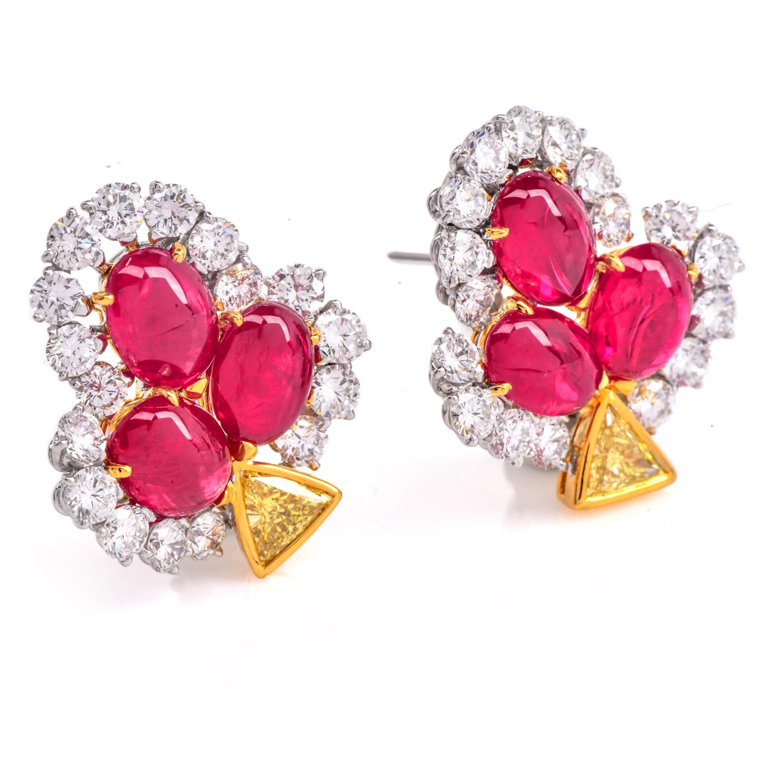 Un elegante par de Pendientes de Rubí Cabujón, Diamante y Diamante Amarillo de Fantasía, elaborados en una combinación de oro blanco y amarillo de 18 quilates.

Estos pendientes presentan exquisitos rubíes cabujón, con un total aproximado de 14,00