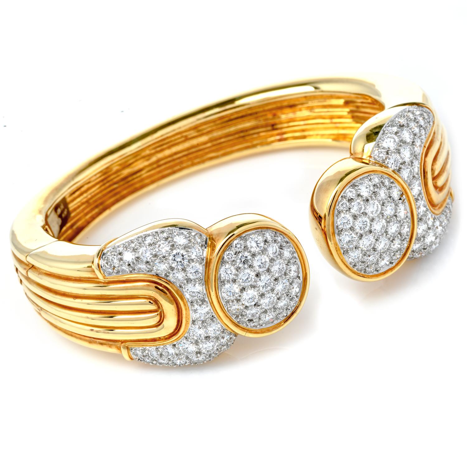 This opulent Bypass Vintage 1980s bracelet is crafted in solid 18K Yellow Gold & Platinum, weighing 77.2 grams, and measures 6.25