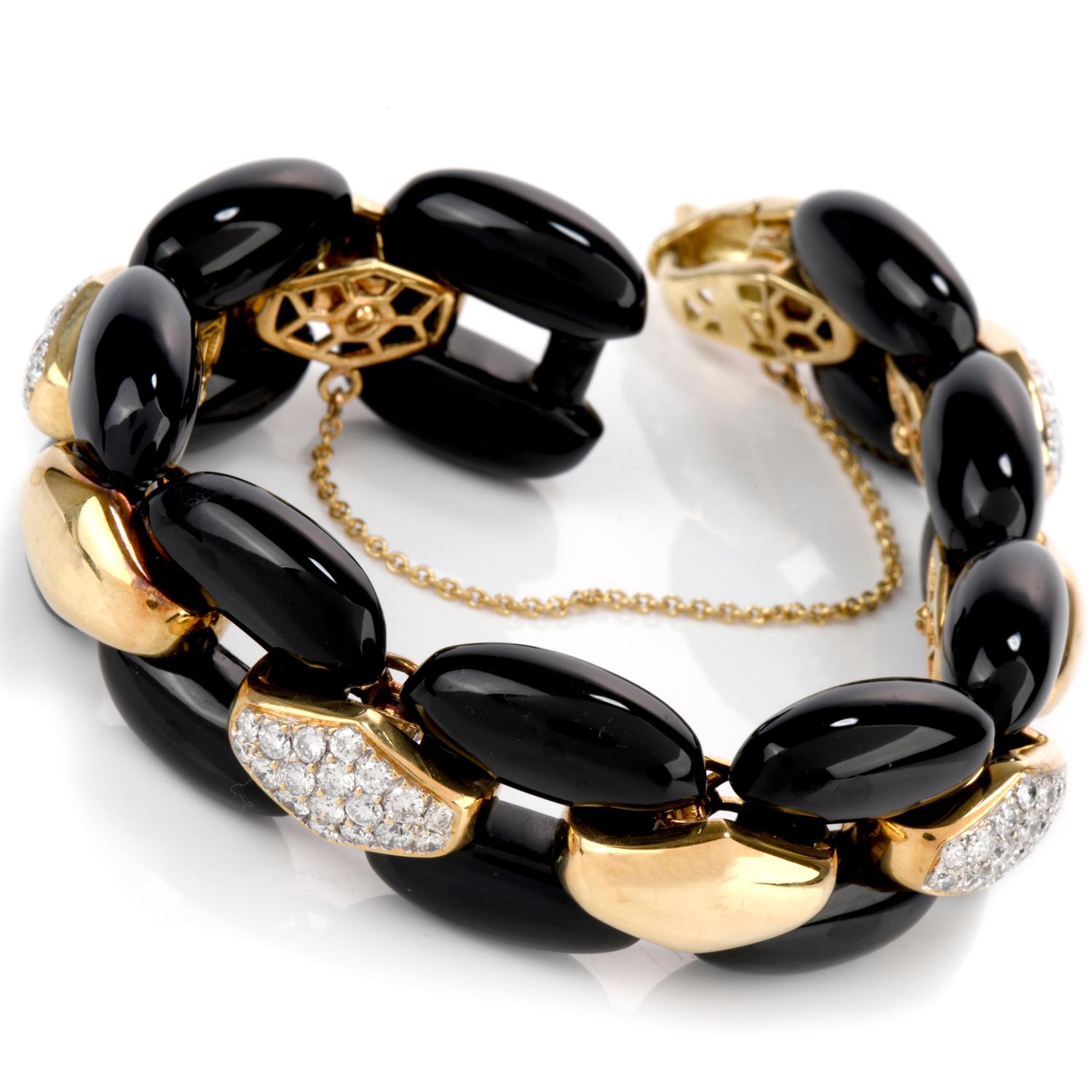 This beautiful and sophisticated Dimaond and Onyx

bracelet was inspired in a  Panther link design and crafted in 18K gold.

Large elongated pieces of Black Onyx are used to constuct the linked frame

with smaller diamond shaped polished domes of