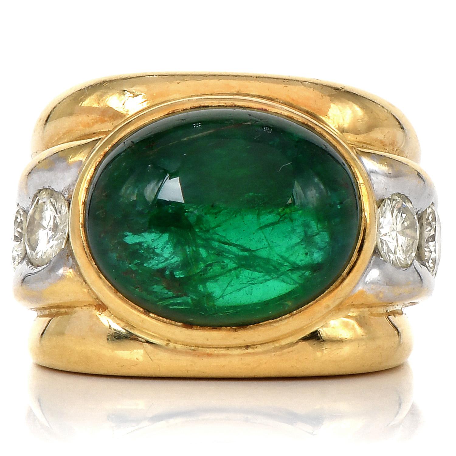 Elegant Vintage Retro 1980s Men's Ring.

Center Green genuine Emerald ring, sided with large-high-quality diamonds.

Crafted in solid 18K Yellow & White Gold, is adorned by a Cabochon Oval cut, Genuine Emerald, bezel-set, measuring 14.88 x 11.76 x