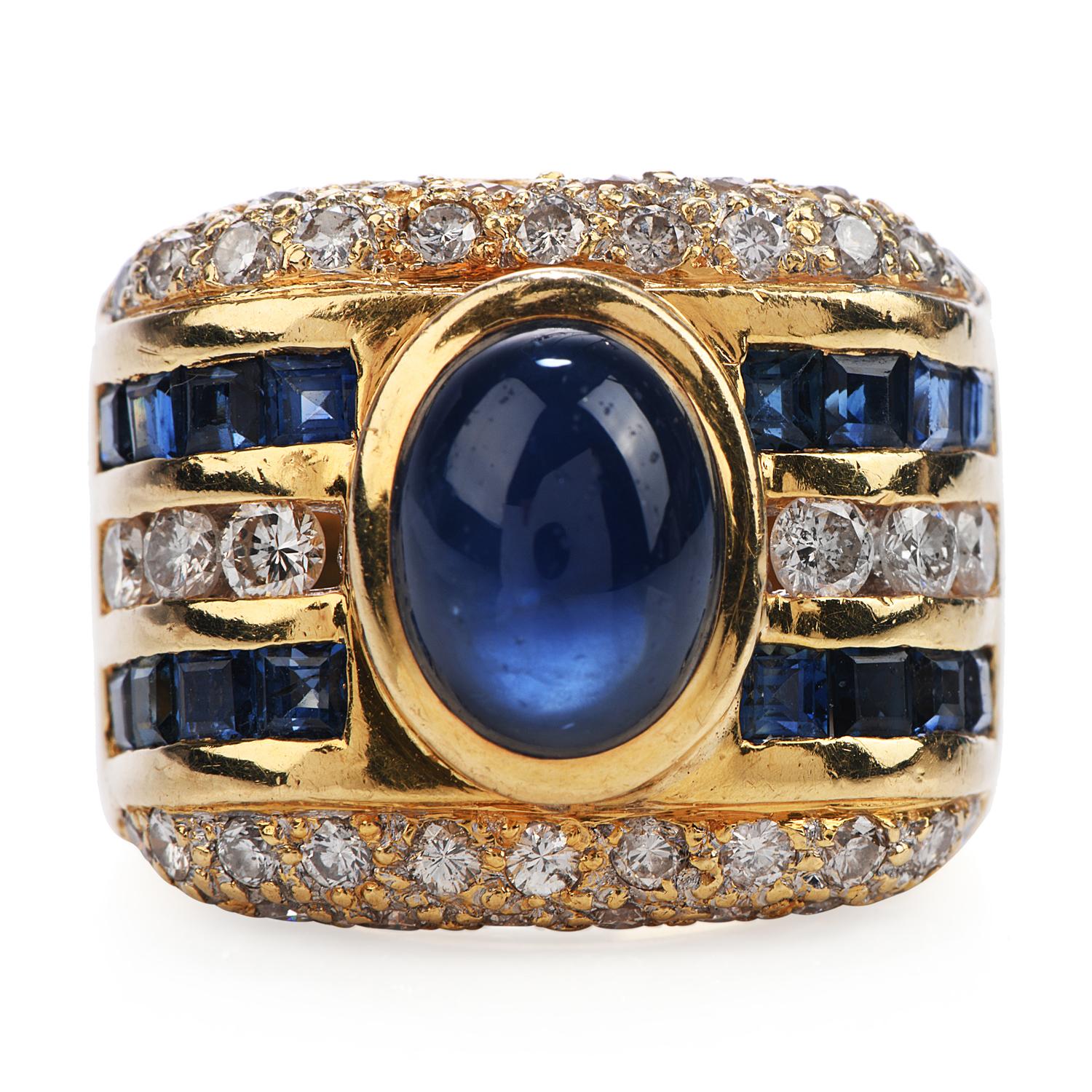This 1980s Estate Piece, is the Perfect Unisex Gift! Crafted in Solid 18K Yellow Gold.

The Wide Design of this band, can be suitable for a Woman statement piece or for a Man's Pinky Ring!

The Center is a Cabochon Oval Cut, Bezel Set, Blue Sapphire