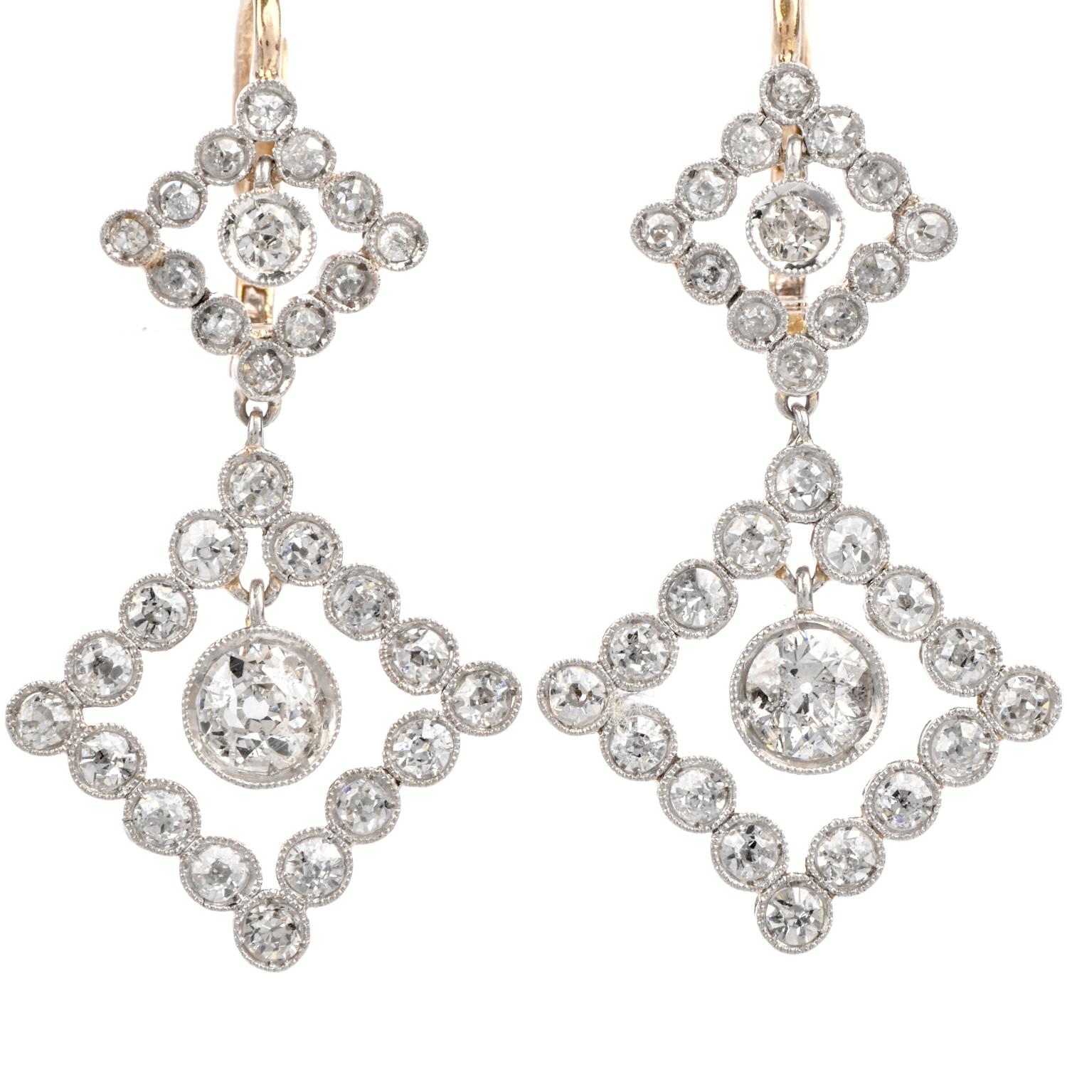 Mix your colors with these extraordinary, sparkling classic vintage Chandelier earrings

Crafted in Platinum and 18K Yellow Gold.

With both the lower diamond shaped segment and the center single

Diamonds able to dangle freely, these earrings flash