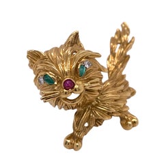 1980's Diamond Emerald Ruby 18 Karat Yellow Gold Vintage Cat Pin Brooch