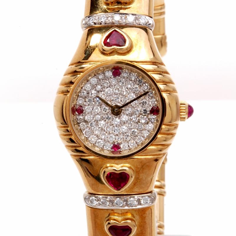 This stunning estate ladies watch is crafted in solid 18K yellow gold. This exquisite time piece displays a cuff  design and is accented with 100 genuine round cut diamonds approx 2.50cttw, G-H color, VVS-VS1 clarity and is accented with 4 genuine