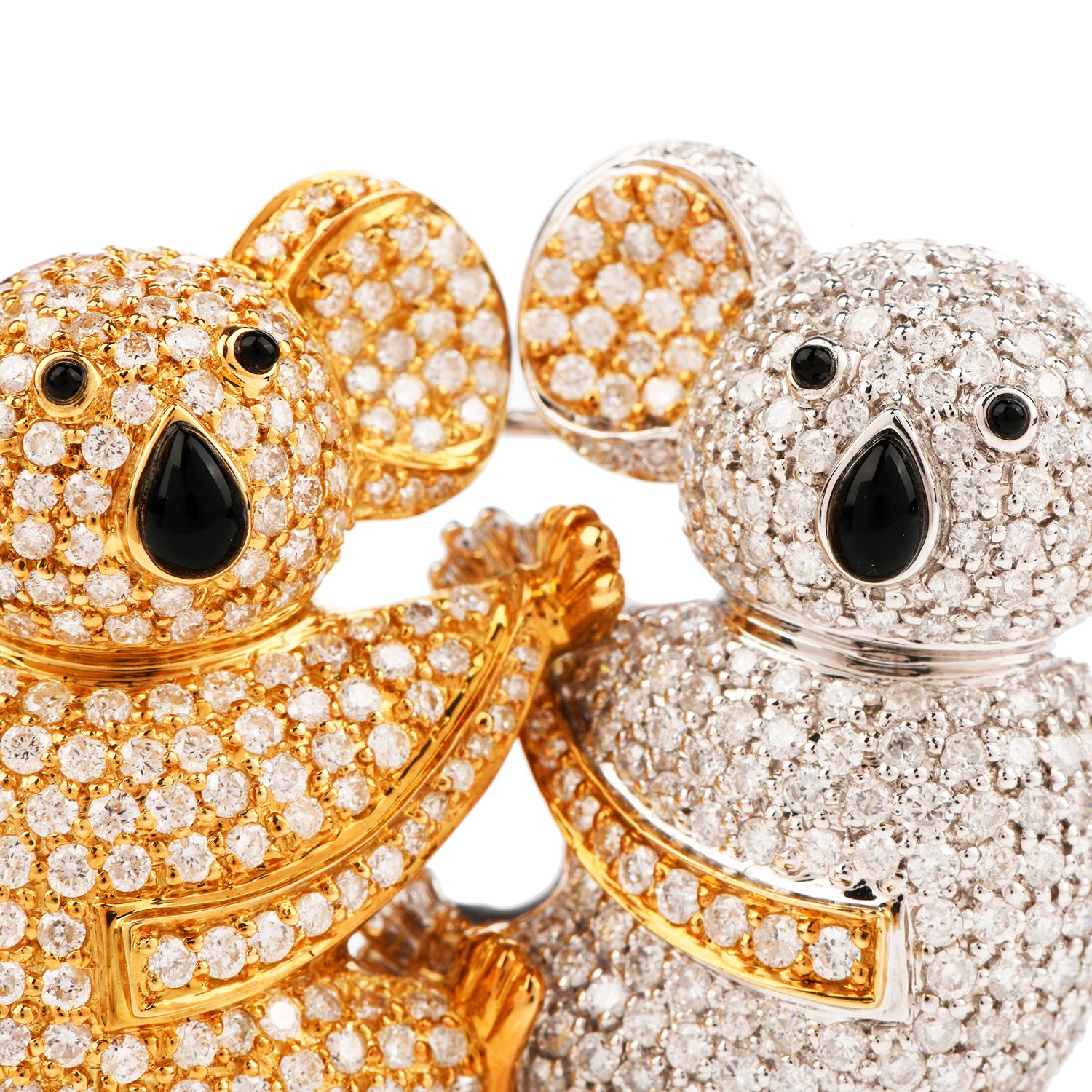 This whimsical diamond koala bear brooch is expertly crafted in a combination of 18-karat yellow and white gold, weighing 23.3 grams and measuring 42mm wide x 30mm long. Depicting two koala bears holding on to one another, pave-set in round-cut