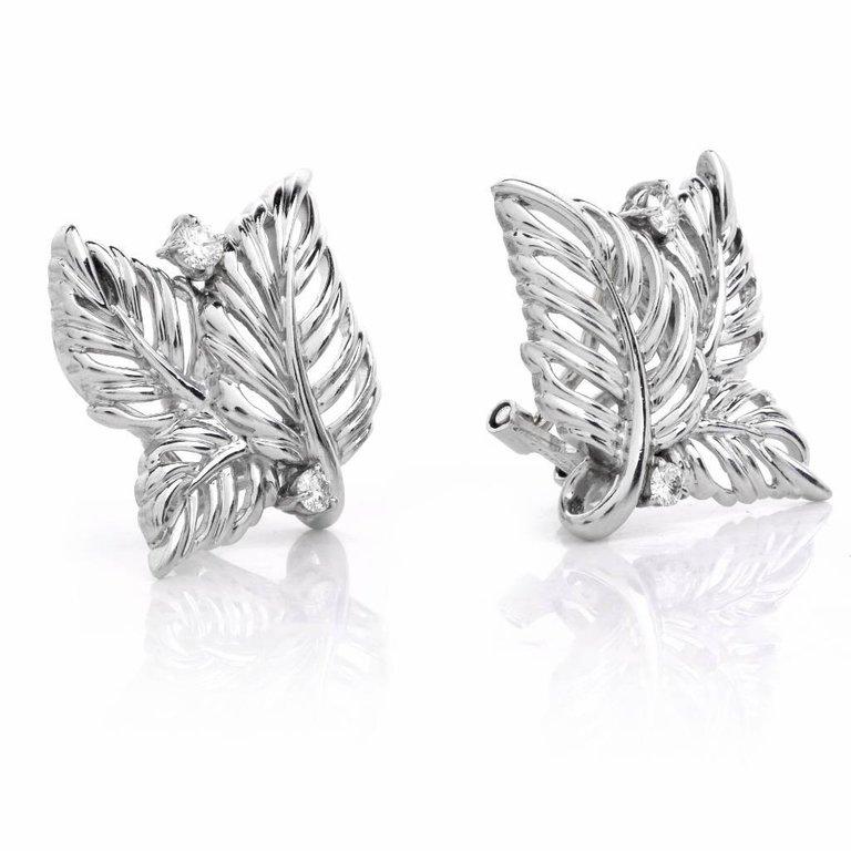 This charming hand crafted Diamond leaf earrings is in solid platinum . Nature inspired leaf motif are adorned with 4 genuine round full cut  approximately 0.15 carats.The diamonds are average G-H in color, and VS1 clarity, expertly set in four