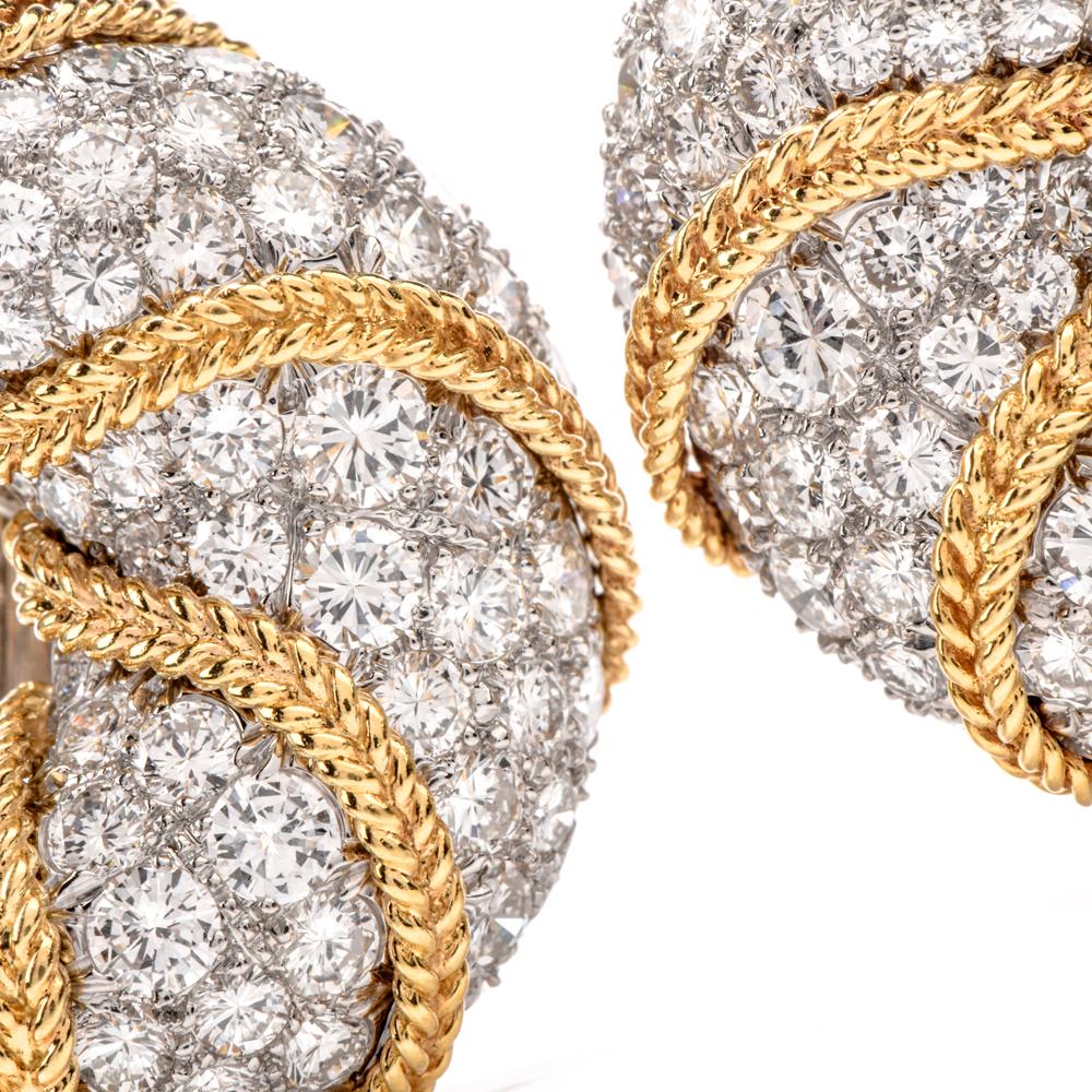 These captivating 1980's  shrimp style half hoop earrings are rendered in Platinum and 18 Karat yellow gold.

the earrings are adorned collectively with 11.10 carats of pave-set round-faceted

diamonds graded F-G color and VVS2-VS1 clarity set in