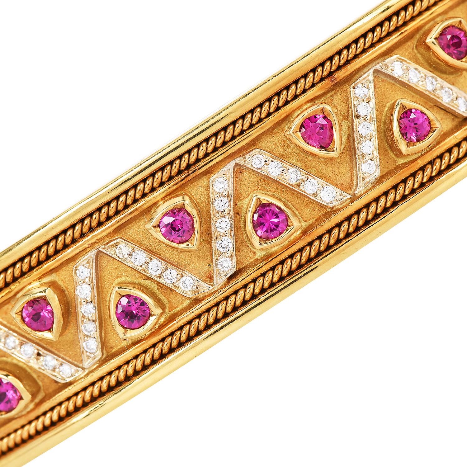This 1980S wide cuff bracelet MAde in Solid 18K yellow gold with genuine Rubies and Diamonds.

The bracelet is decorated with precious stones Rubies, and diamonds set in a Triangle Design Pattern. 

The Cuff bracelet has a hinged insert secure