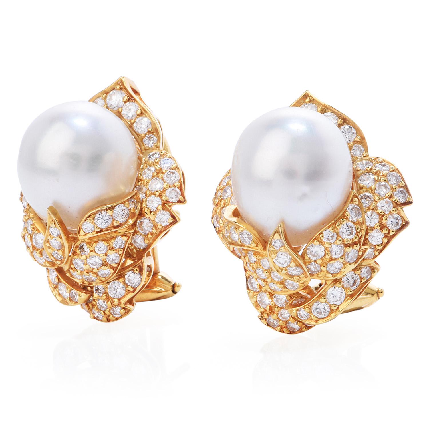 Late 1980's floral clip-on earrings, with shimmering Diamond & Pearls. 

Crafted in solid 18K yellow gold, there are 130 round-cut, pave-set, Diamonds weighing approximately  2.80 carats(H-I color and VS  clarity

Complementing the look are (2) oval