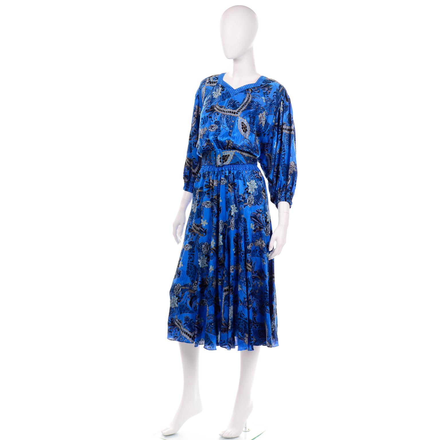 We acquired this 1980's Diane Freis vintage dress from the estate of a woman who had a huge Diane Freis collection. This dress is in a beautiful paisley print silk in a vibrant blue with some mustard, sky blue, and black details. The neckline is a