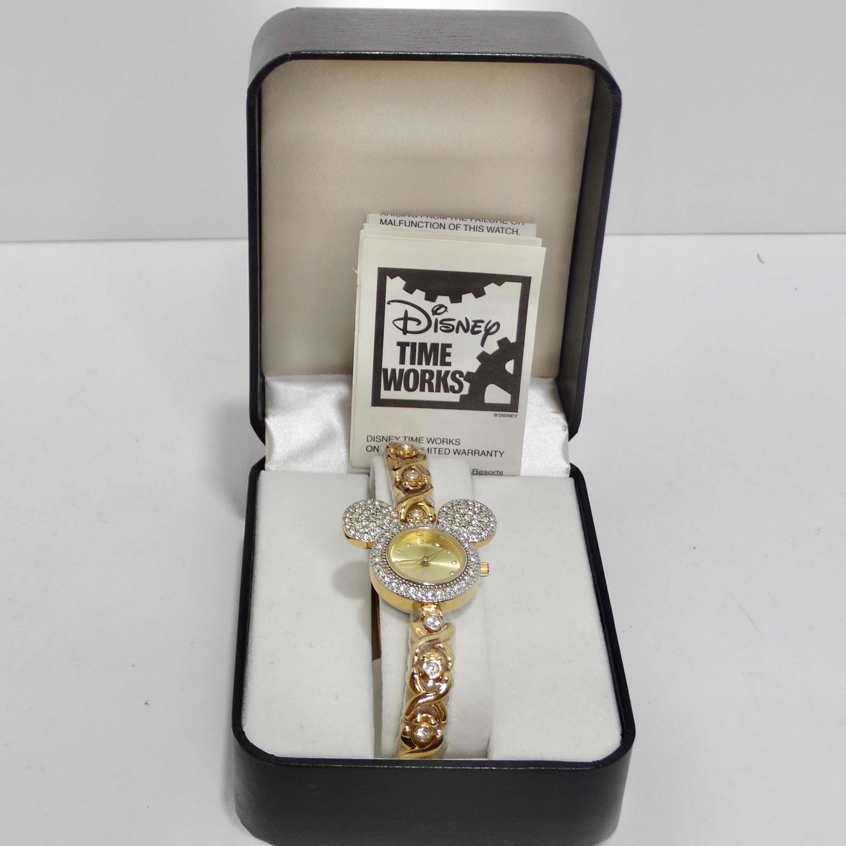 Step back in time with this 1980s Disney Mickey Mouse Gold Plated Rare Collectible Watch. This iconic timepiece, plated with radiant yellow gold and adorned with round clear crystals, is a true gem for collectors and Disney enthusiasts. The