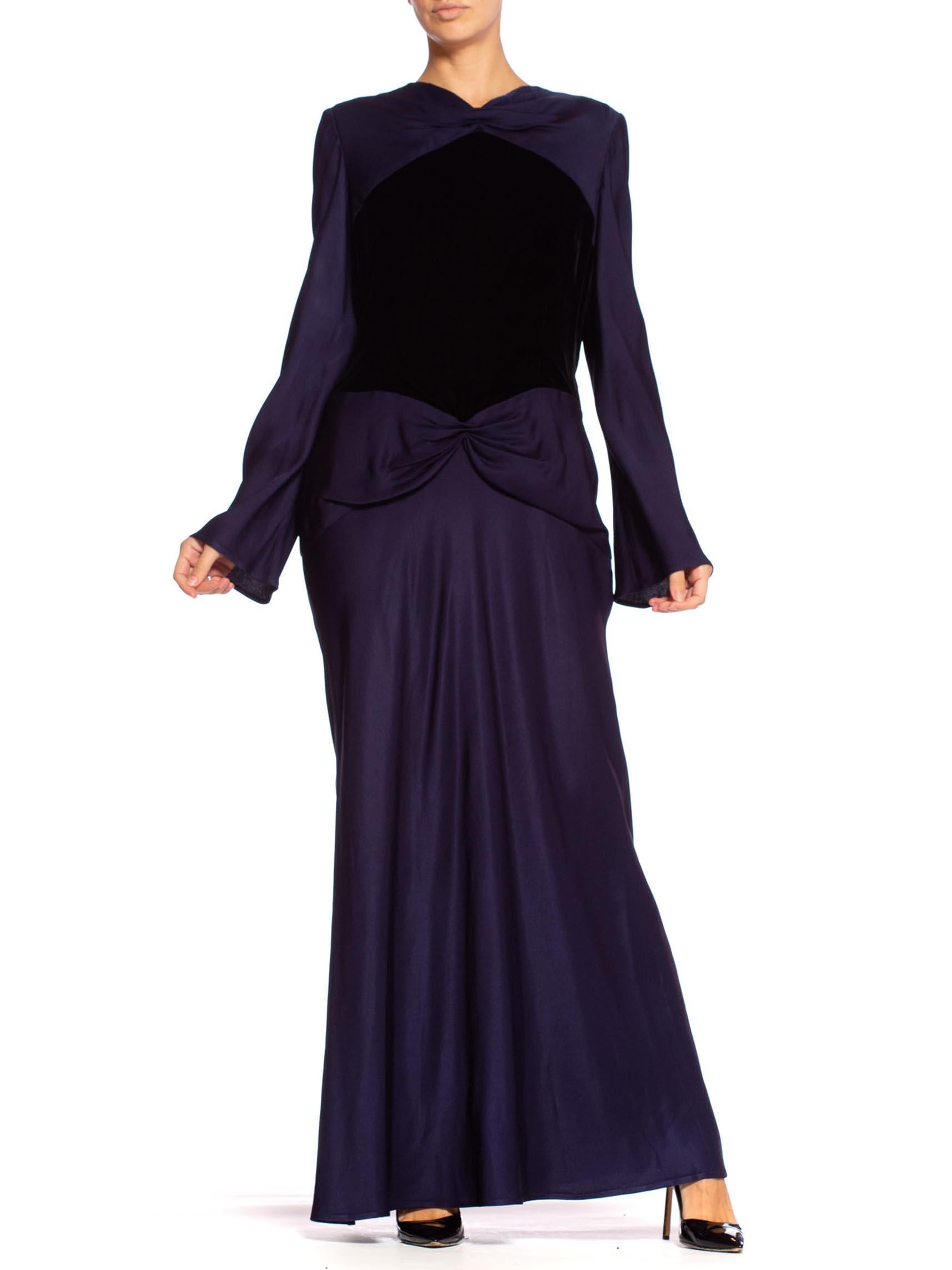 Beautifully hand finished and half lined in soft tissue silk. Bias cut to the skirt and sleeves. 1980'S BILL BLASS Navy Blue Haute Couture Silk Crepe Back Satin Sleeved Gown With A Black Velvet Bodice 