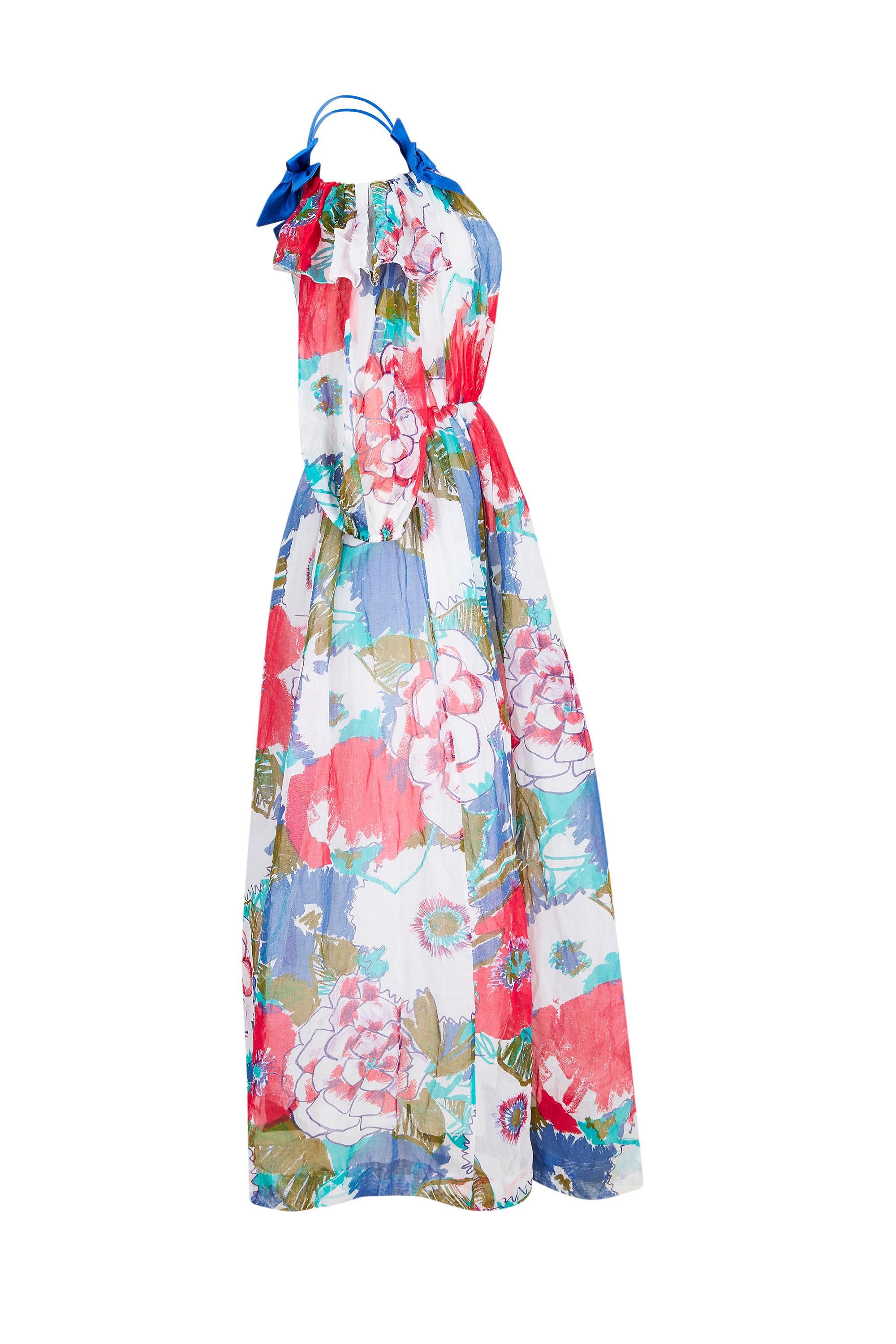 1980s printed cotton organdy dress is by British designer Donald Campbell who created beautiful, individually cut ready to wear pieces from quality couture fabrics from the early 70's to late 00's. The bold floral print depicts poppies and roses in