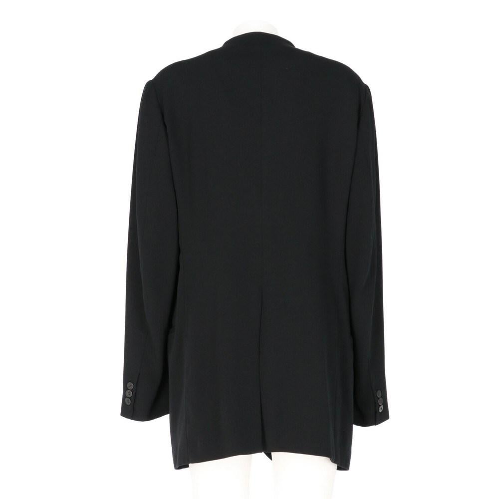 Donna Karan black wool crew neck jacket. Frontal buttoning. Long sleeves with buttoned cuffs. Four welt pockets. Lightly padded shoulders. Fully lined.

Size: 44 IT

Flat measurements
Height: 85 cm
Bust: 51 cm
Shoulders: 50 cm
Sleeves: 65