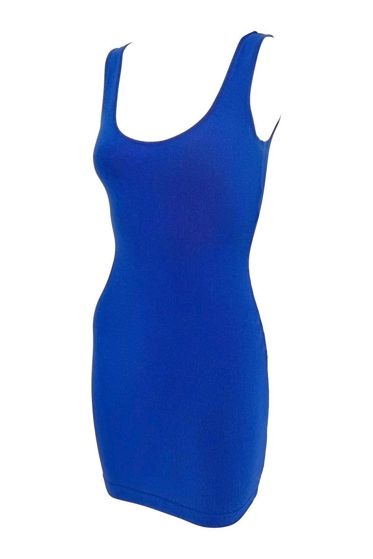 This Donna Karan cocktail dress from the 1980s is crafted from vibrant blue knit. The bodycon silhouette features a scoop neckline and figure-hugging fit. 

Approximate measurements:
Size - Petite
Bust: 30