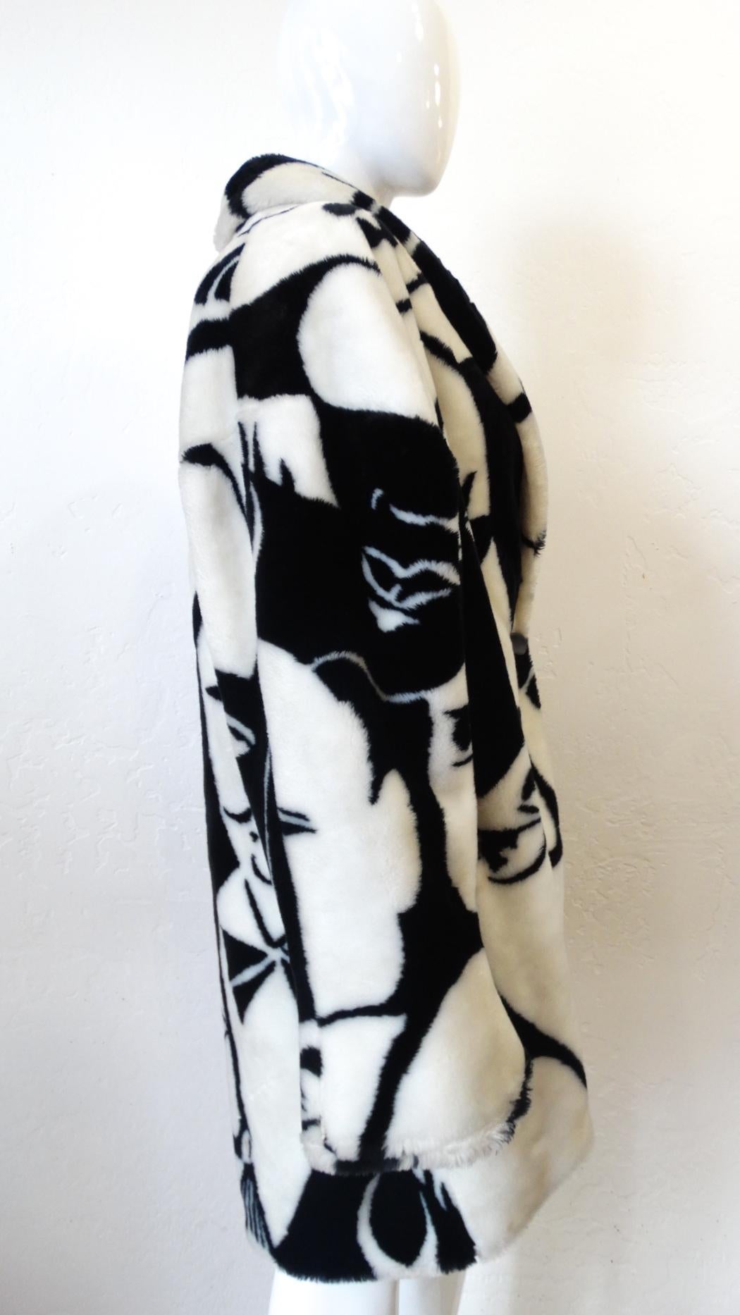 The Most Amazing Coat Is Waiting For You! Circa 1980s, this DonnyBrook's billowy faux fur coat features a contrasting black and white face motif reminiscent of Picasso. Coat includes a shawl collar and a single oval matte black button right below