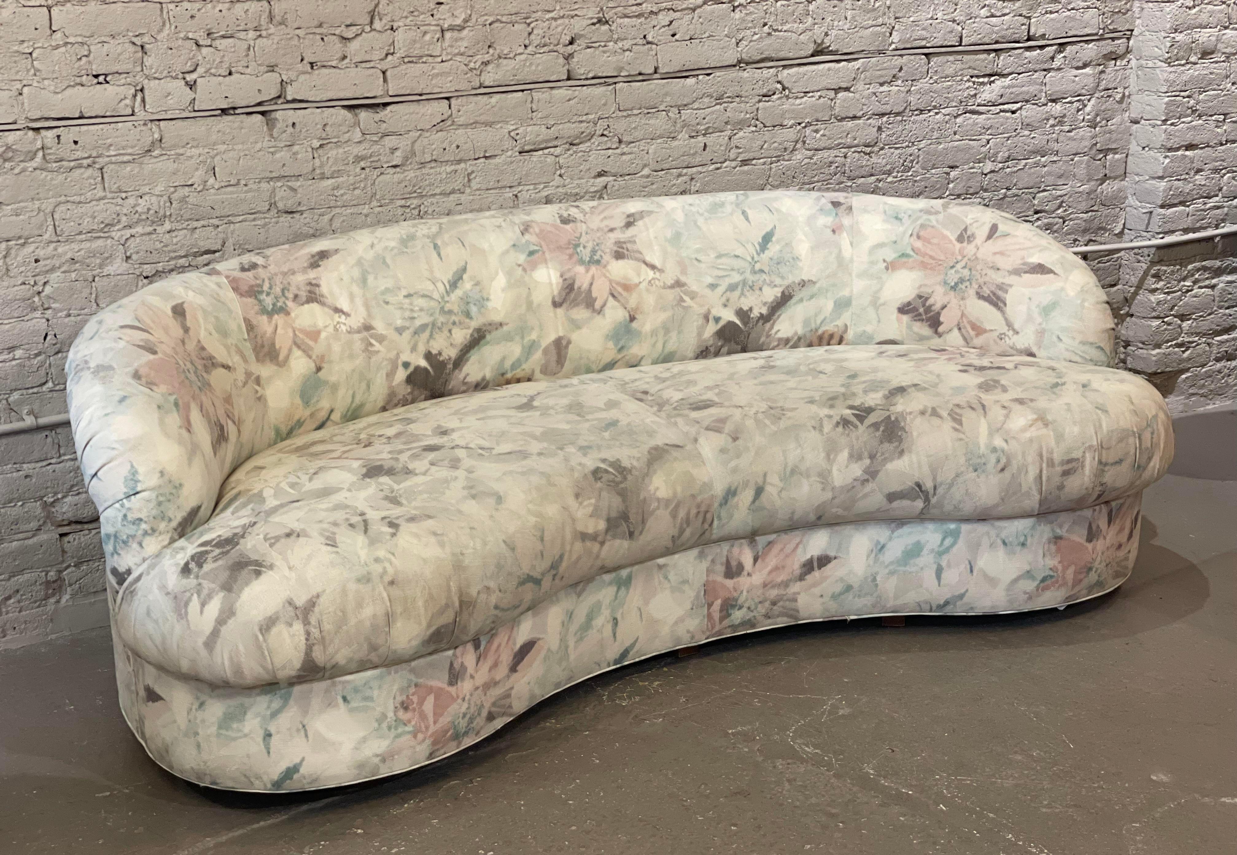 Oh the perfectly curved sofa. Use in your living room or kitchen banquette.
The original floral upholstery is in good condition. The foam is in excellent condition.
