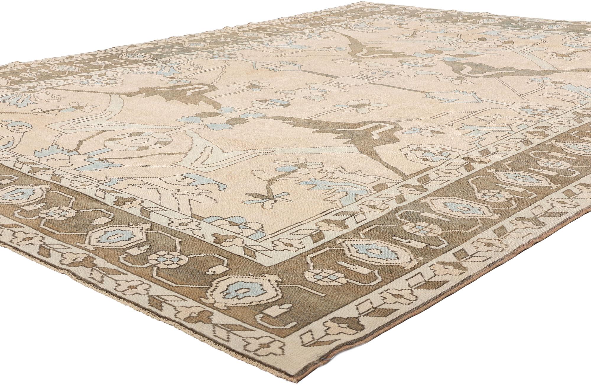53485 Vintage Turkish Oushak Rug, 09'01 x 11'09. Woven like a memory from the hills of Anatolia, this hand-knotted wool vintage Turkish Oushak rug sings with a quiet yet profound lyricism. Its pale parchment field, kissed with natural abrash, sets