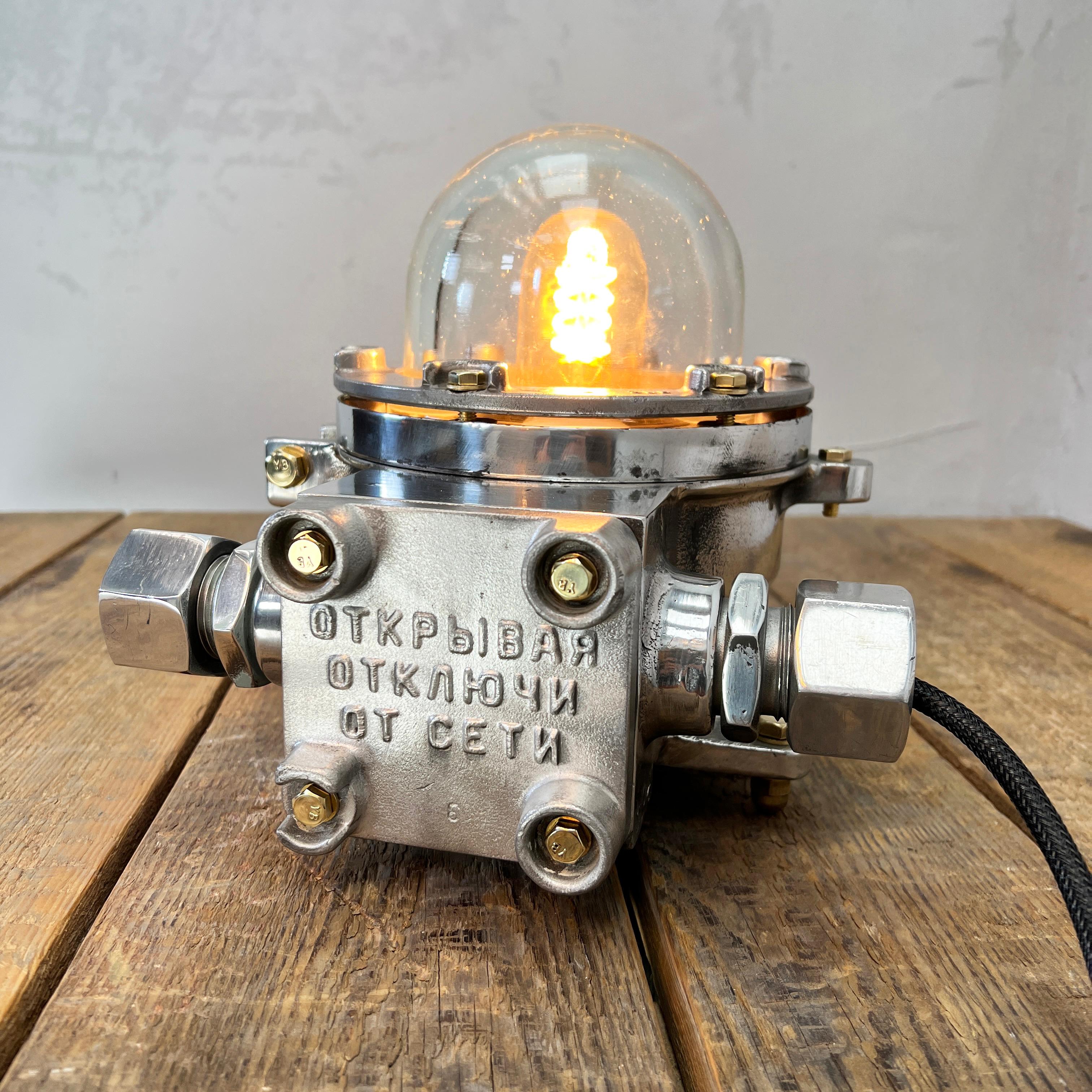 Eastern Bloc naval aluminium lamp reclaimed from decommissioned 1980's cargo ships. Professionally restored and rewired by hand in our workshop, ready to be reused in modern interiors or outdoor living spaces. 

This variant was originally a wall