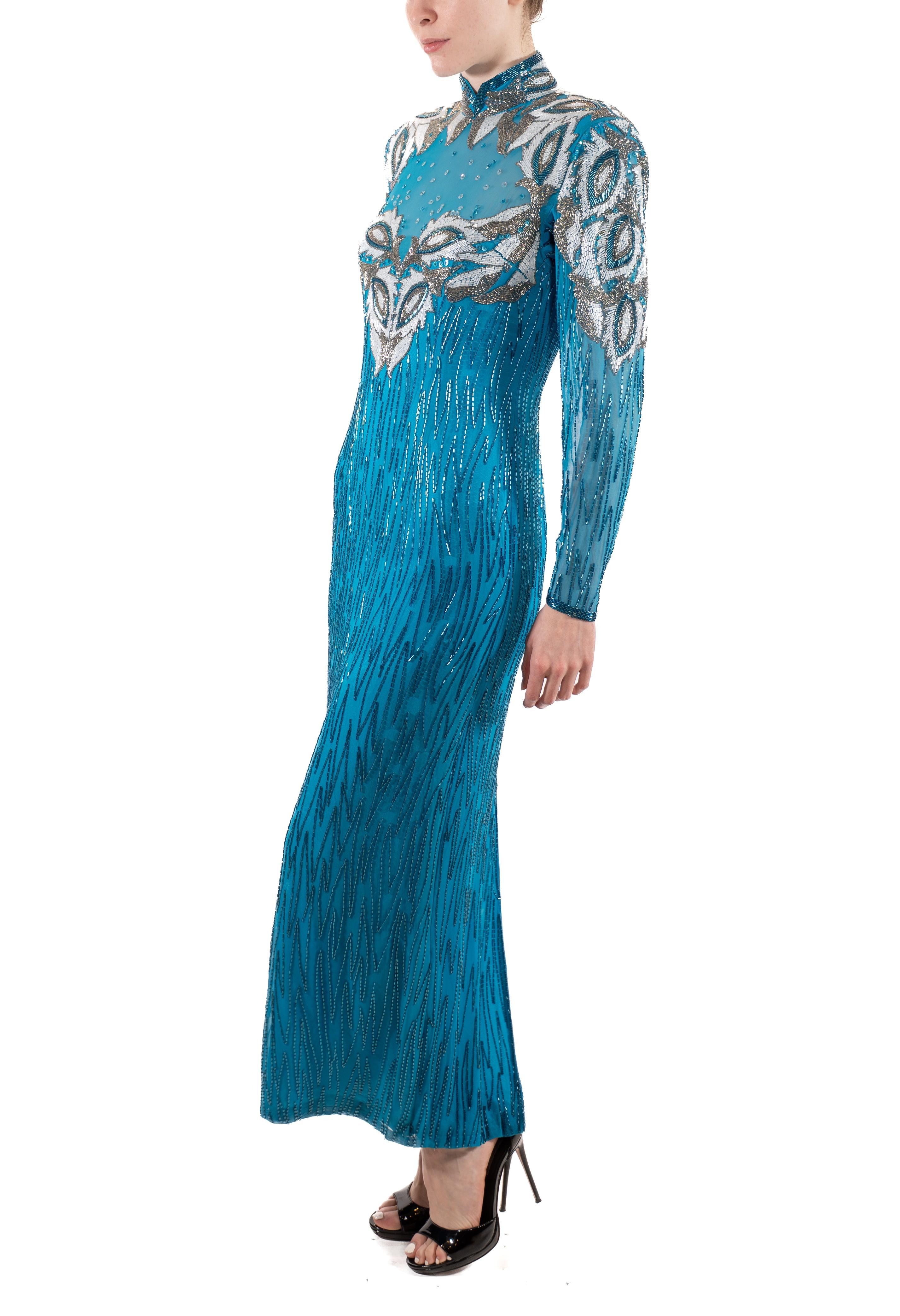 In great condition, some small areas of age fading. Fully lined and cleaned, feels luxurious to wear. 1980S Electric Blue Beaded Silk Chiffon Dynasty Gown With Sleeves 