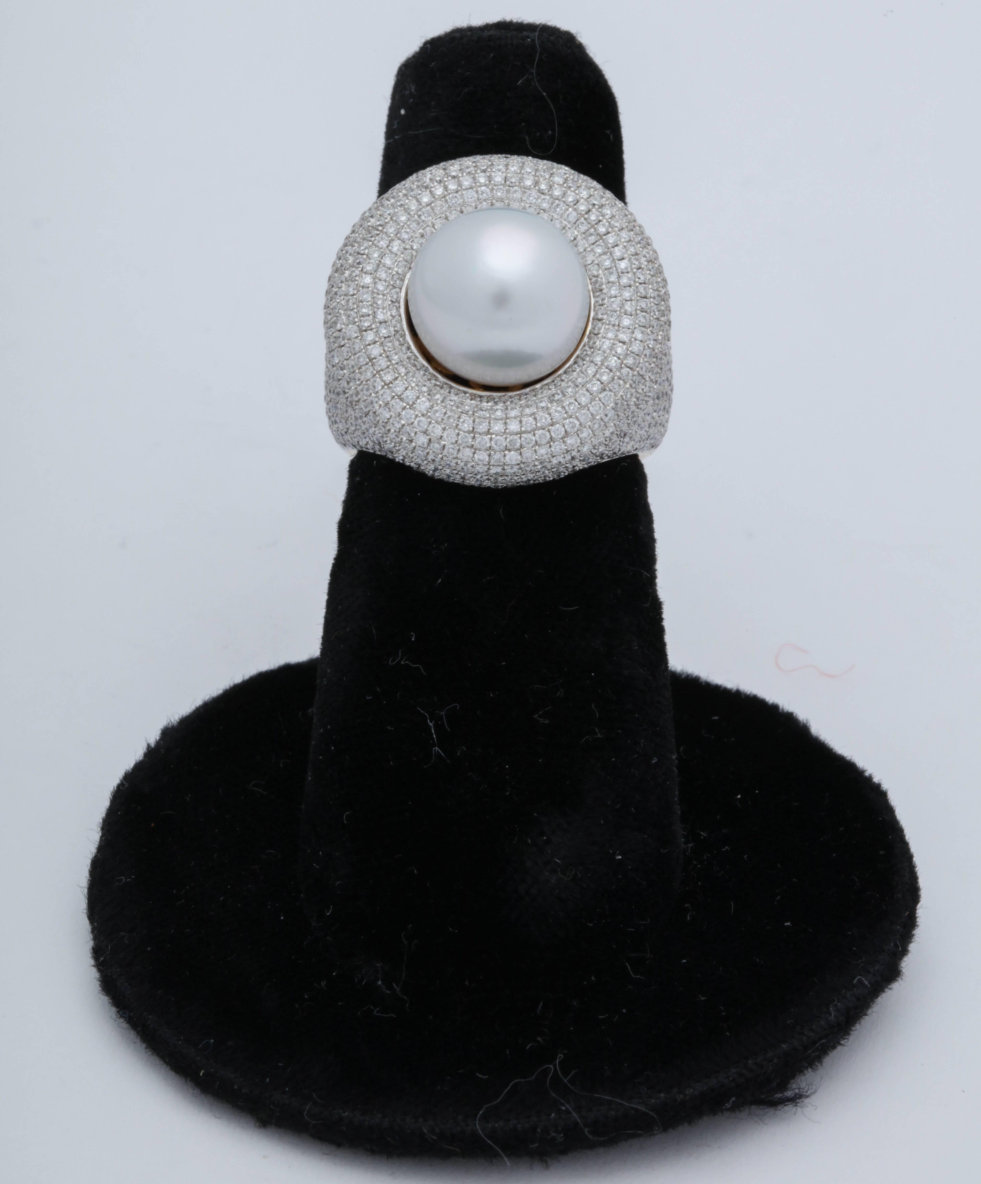 One Ladies 14kt White And Yellow Gold Cocktail Ring Centering A 9MM High Quality And High Luster Cultured Pearl . This Elegant And Ultra Chic Ring Is Also Embellished With Numerous Full Cut diamonds Weighing Approximately 3 Carats Total weight.