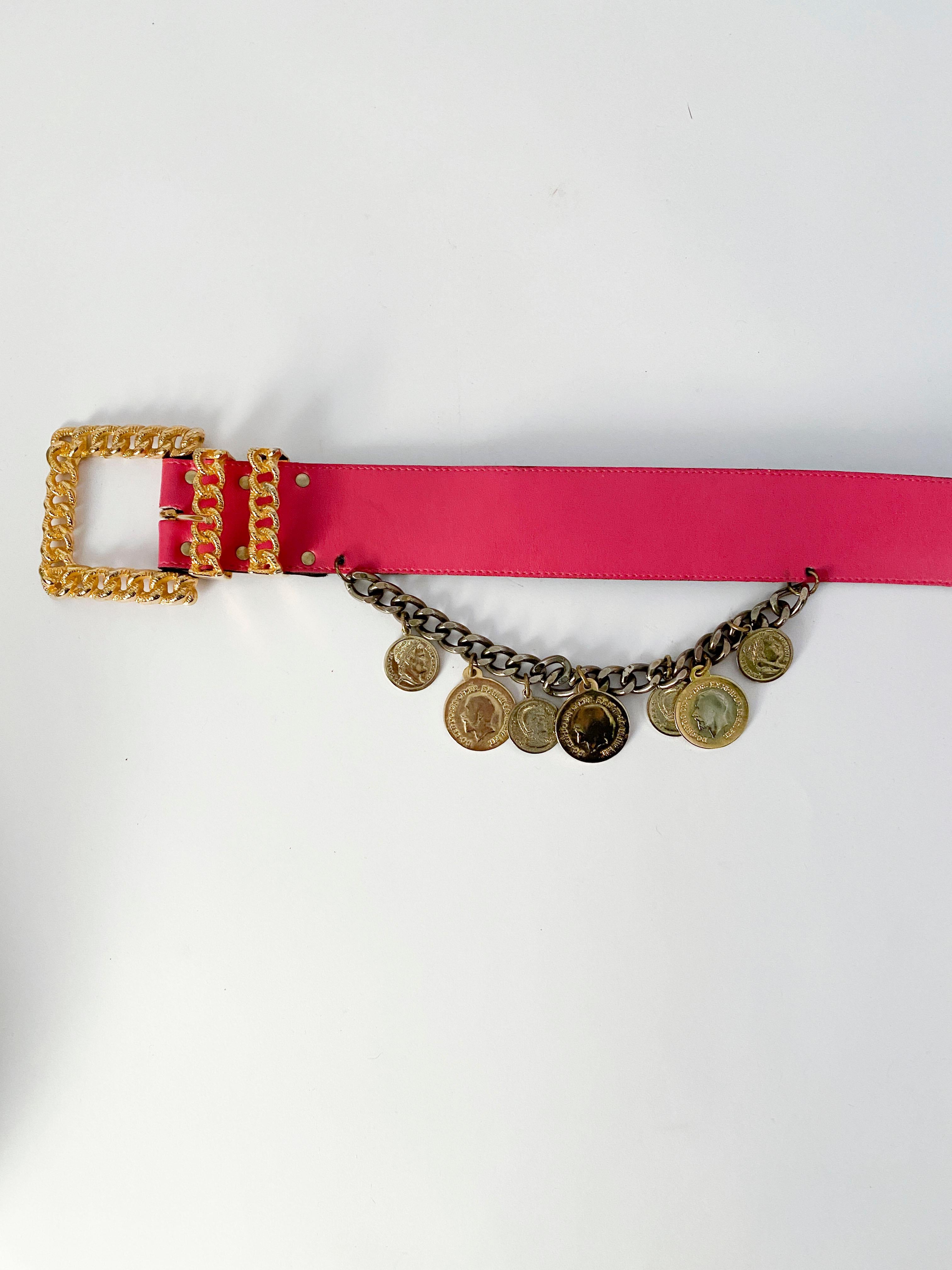 1980s Fucsia Elizabeth Arden leather wide belt with a gold tone chain adorned with polished coins.