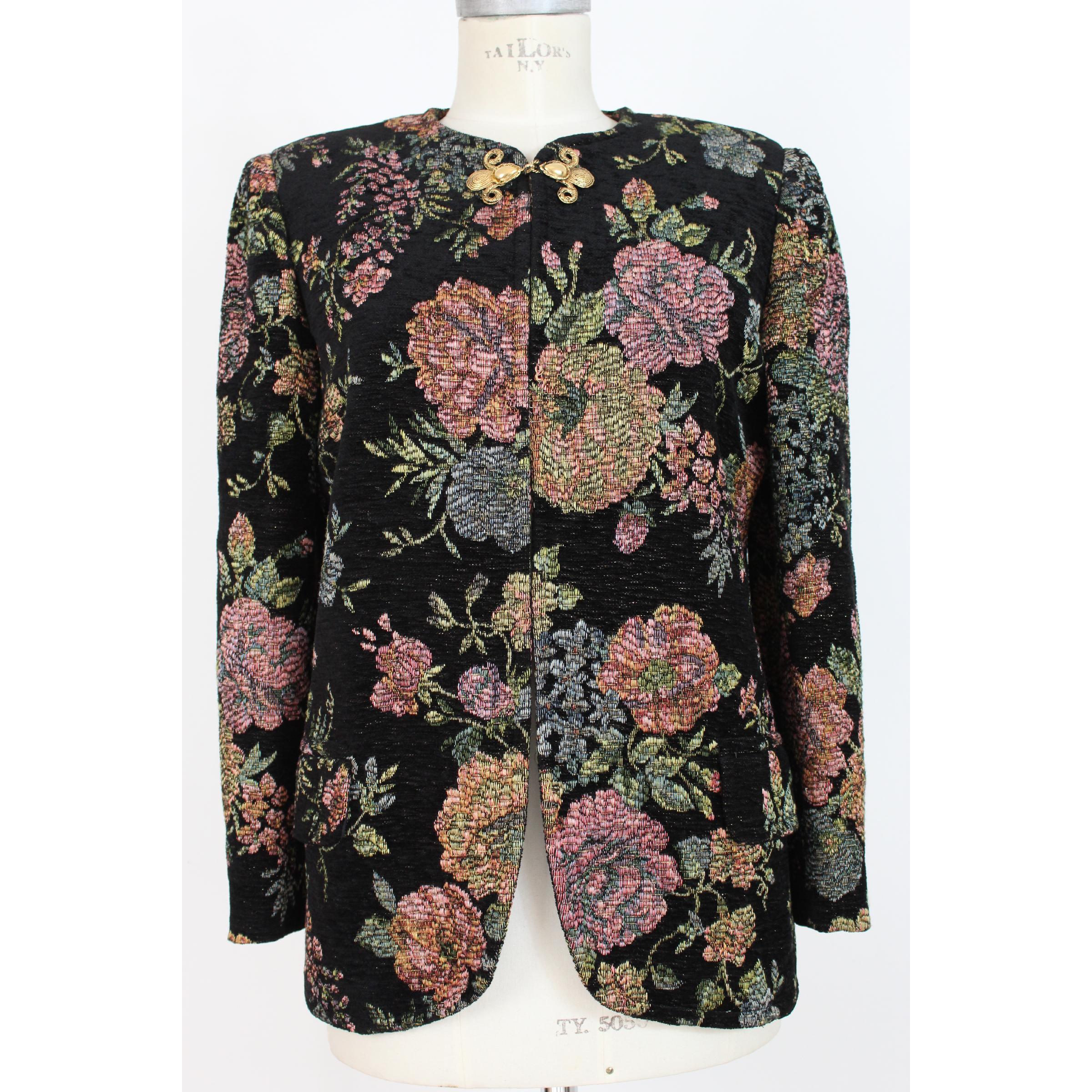 Emanuel Ungaro vintage women's jacket in wool, black color with application of multicolored embroidered flowers. Chiusra with gold-colored hook. 1980s. Made in Italy. Excellent vintage conditions.

Size: 44 It 10 Us 12 Uk

Shoulder: 44 cm

Bust /