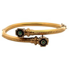 1980er Jahre Bypass-Armreif aus 14 Karat Gelbgold mit Smaragd und schwarzer Emaille
