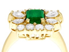 1980s Emerald Cut Emerald 1.32 Carat Diamond Yellow Gold Cocktail Ring