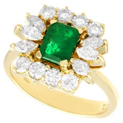 1980s Emerald Cut Emerald 1.32 Carat Diamond Yellow Gold Cocktail Ring