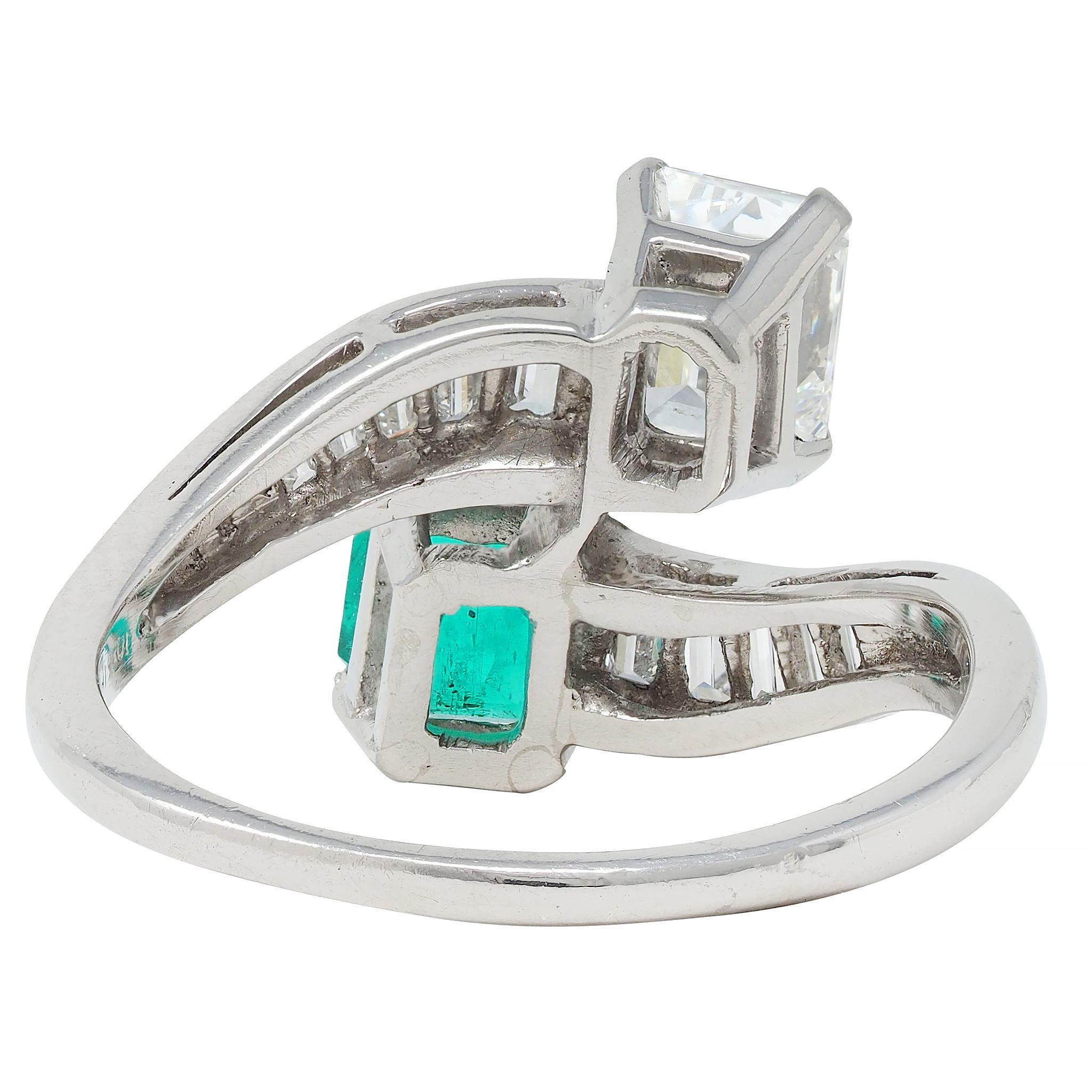 Women's or Men's 1980's Emerald Diamond Platinum Vintage Toi-Et-Moi Bypass Engagement Ring For Sale