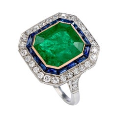 Vintage 1980s Emerald Diamond Sapphire Platinum 18 Karat Gold Cocktail Ring