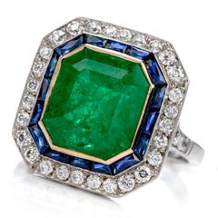 1980s Emerald Diamond Sapphire Platinum 18 Karat Gold Cocktail Ring