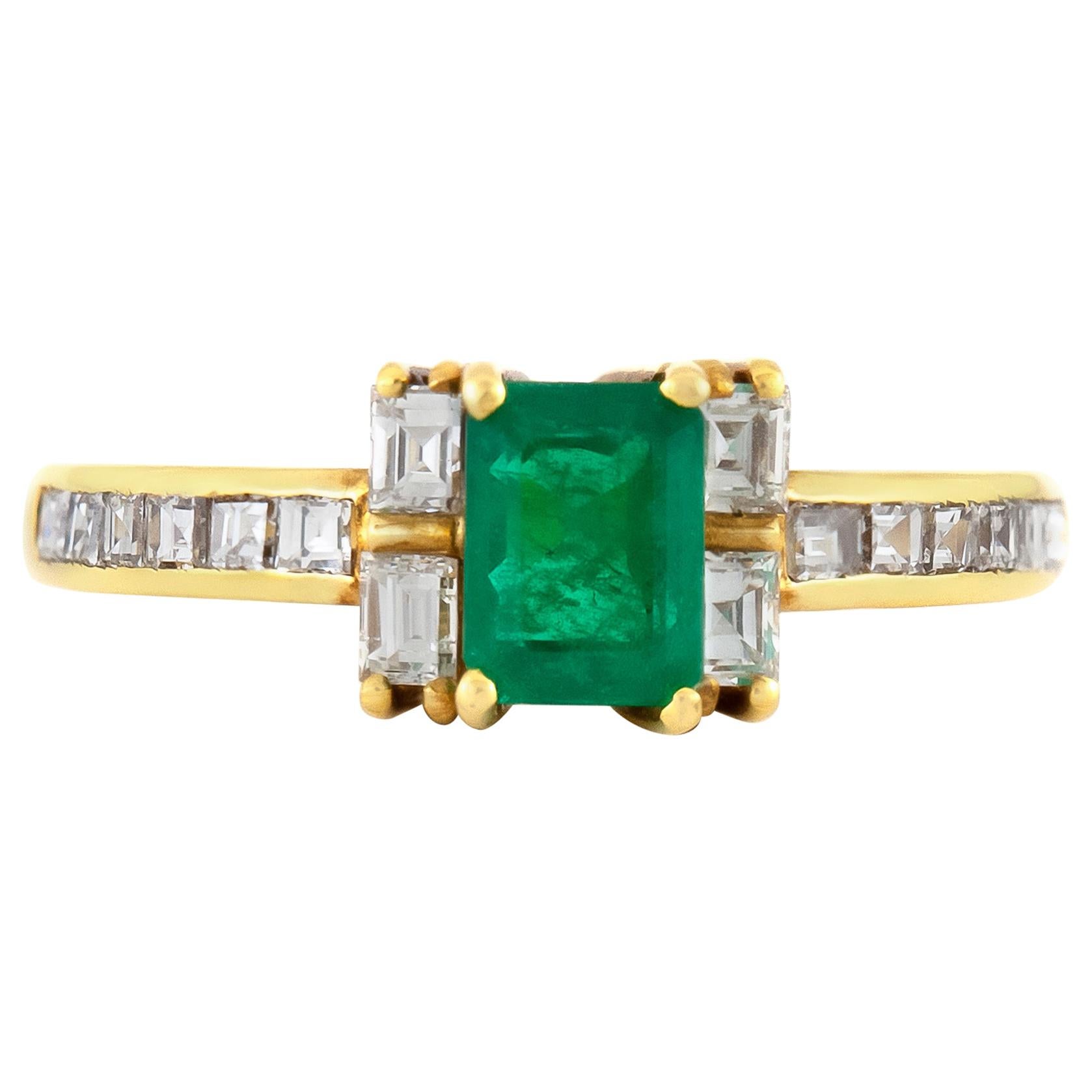 1980s Emerald Engagement Ring with Diamonds on the Side For Sale