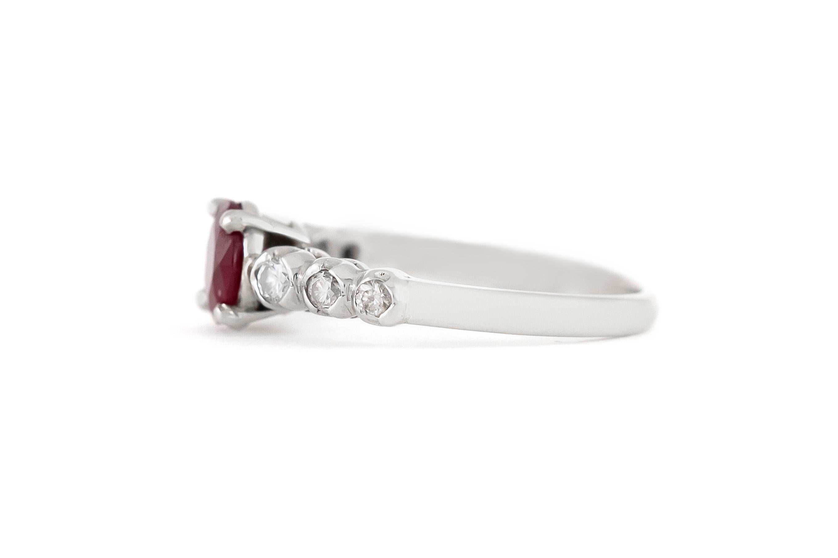 The ring is finely crafted in platinum with ruby center stone weighing approximately total of 0.70 carat and diamonds weighing 0.30 carat 
Circa 1980.