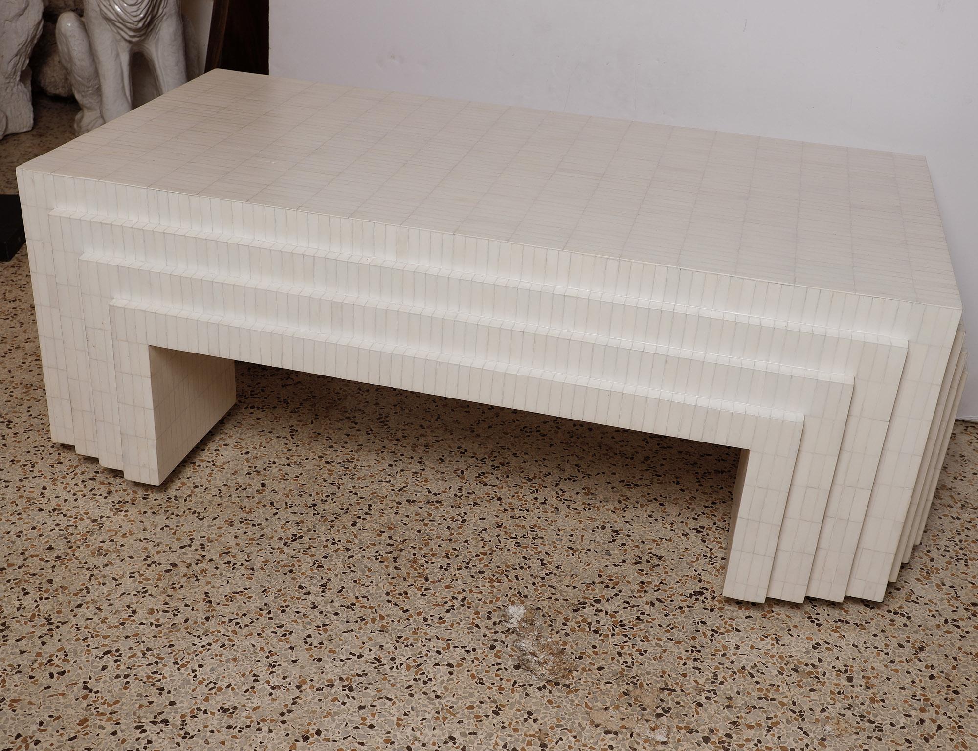 Intricate and elegant stair-stepped 1980's Enrique Garces tessellated bone coffee table, professionally restored to a rich, creamy matte finish. 
Beautiful condition ...
 