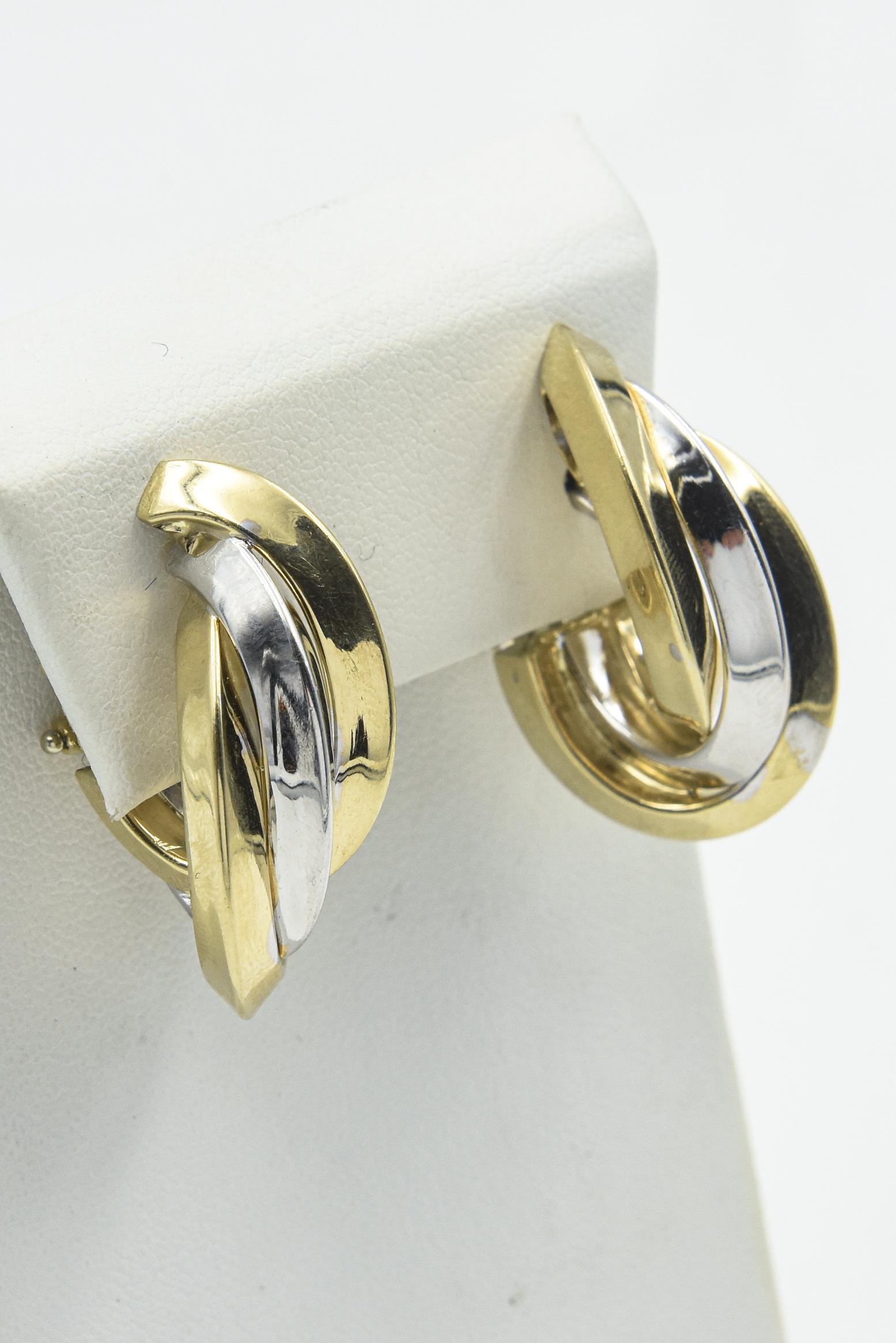 Fabulous vintage 14k yellow and white gold entwined hoop earrings featuring two yellow gold hoops with a white gold center hoop.   They are a substantial size measuring 1.30