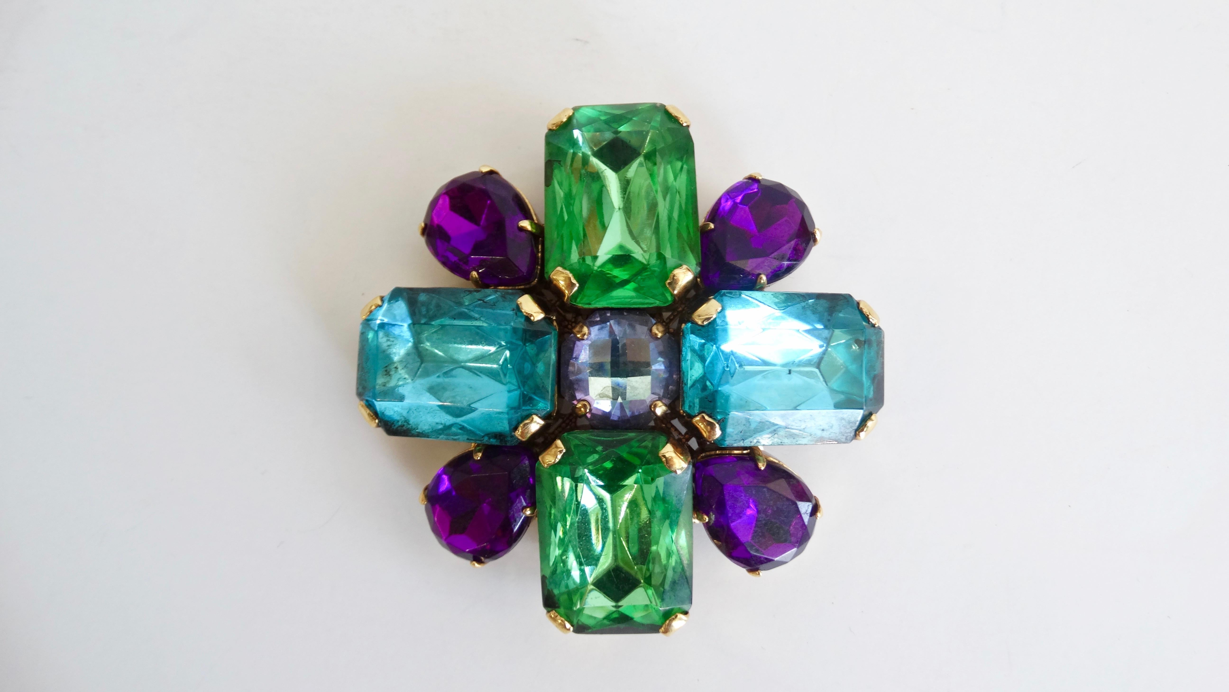 Give your outfit a little flare with these Erickson Beamon brooches! Circa late 1990s, these costume brooches feature multi-colored rhinestones in the shape of a burst or flower. The perfect piece to pin on your favorite vintage denim jacket or