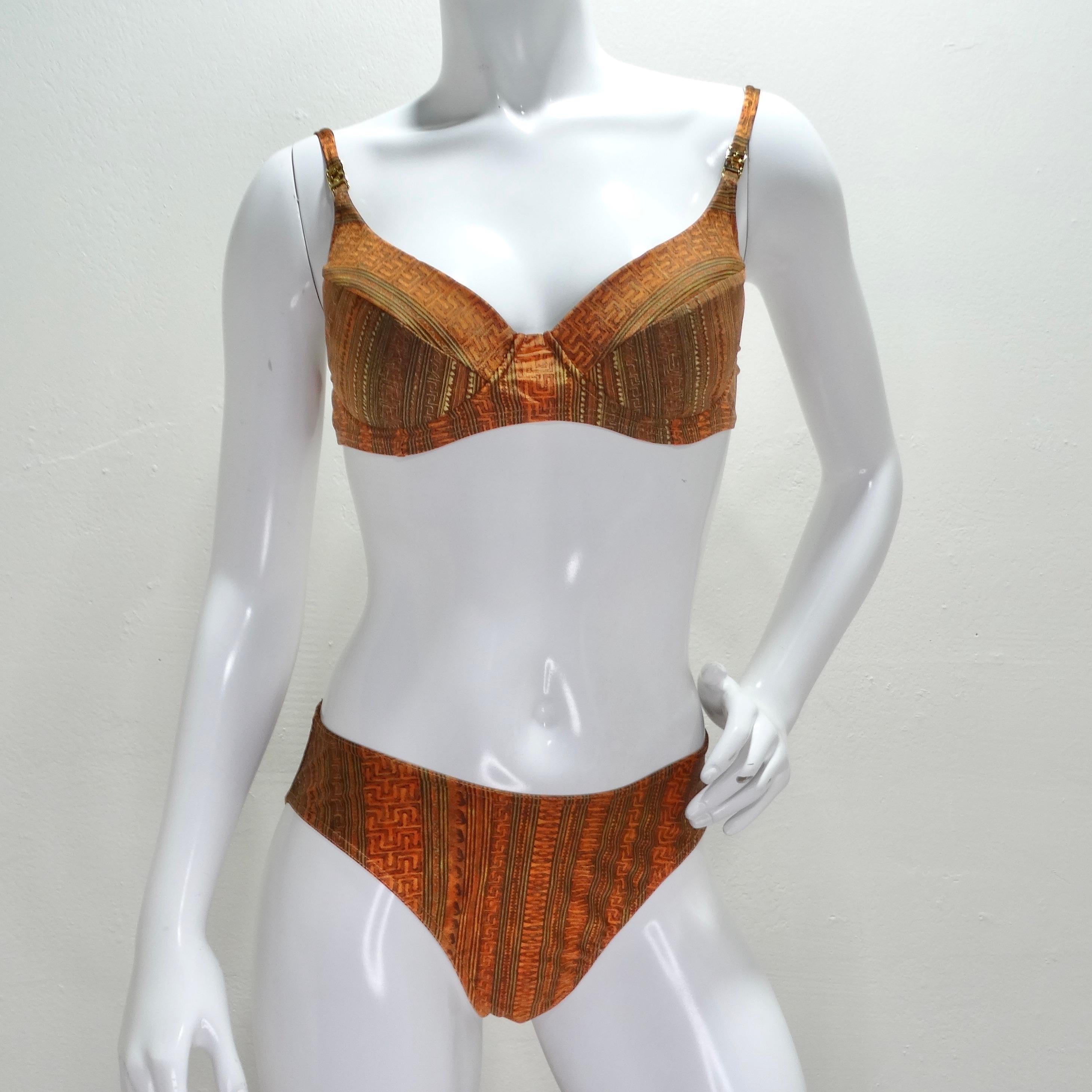 Do not miss out on this stunning piece of swimwear that captures the essence of the 1980s fashion era - the Escada bikini. With its semi full coverage high waisted style, this bikini offers a touch of vintage charm combined with a modern twist. The
