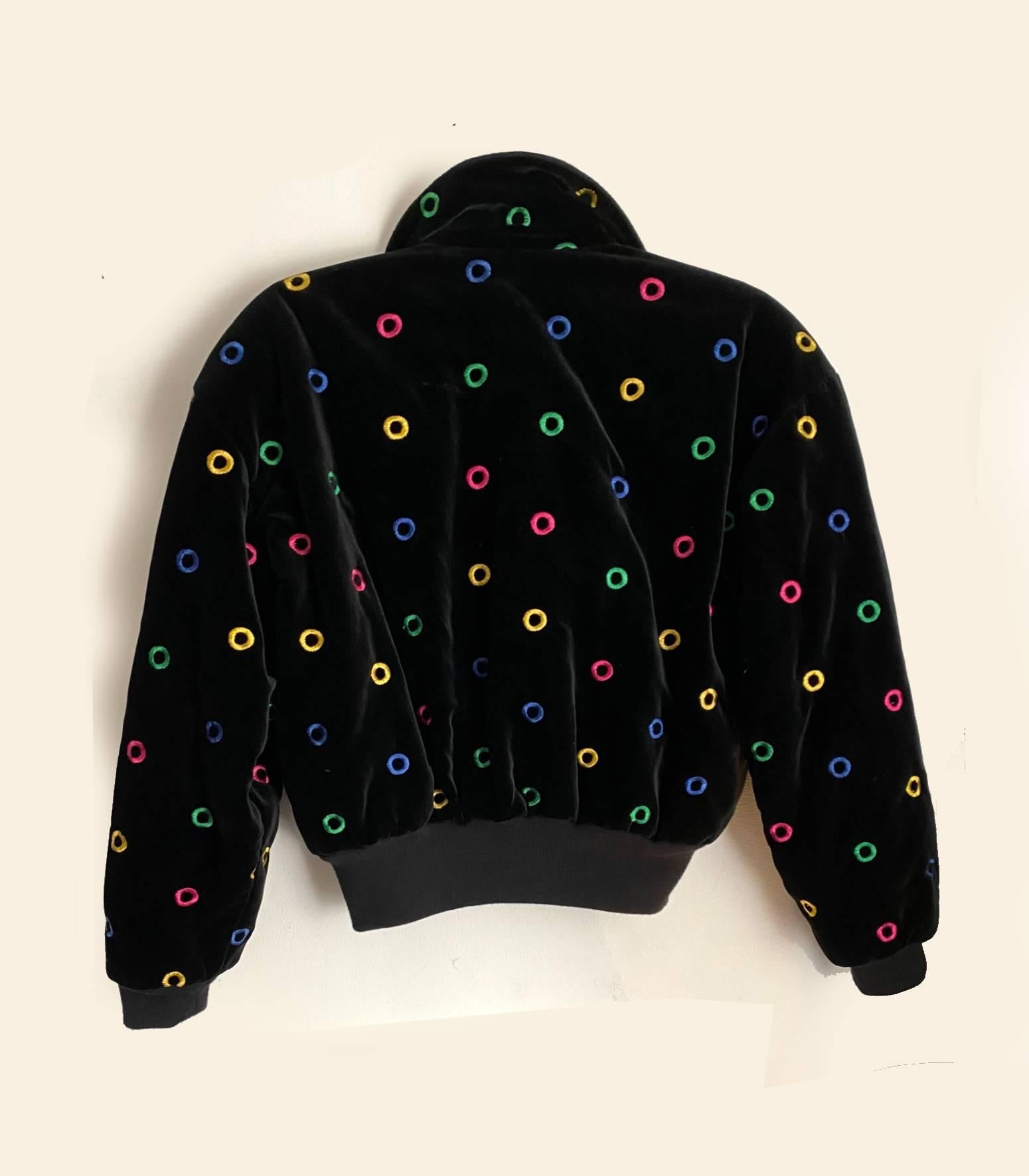 Amazing Escada piece straight from the 80s, bomber cropped padded jacket, black soft velvet, embroidered multicolor circle details, gold tone metal-ware, two front zipped pockets, padded warm pink silk logo printed lining, over shouldered design,