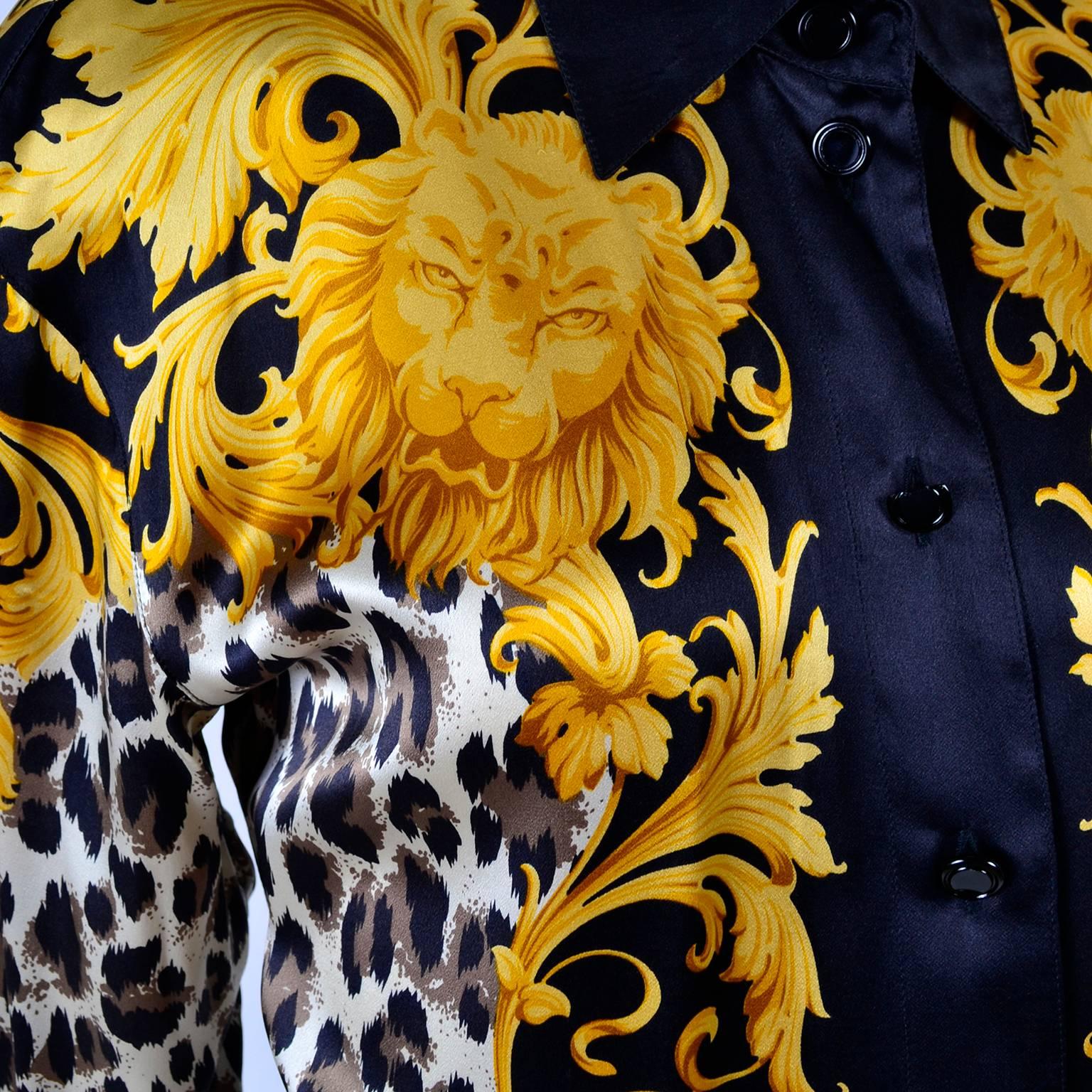 This vintage Escada silk blouse was designed by Margaretha Ley for Escada in the 1980's.  The blouse is in a baroque black and brown animal print with yellow lion faces and leaves. This beautiful blouse has solid black cuffs and collar and we also