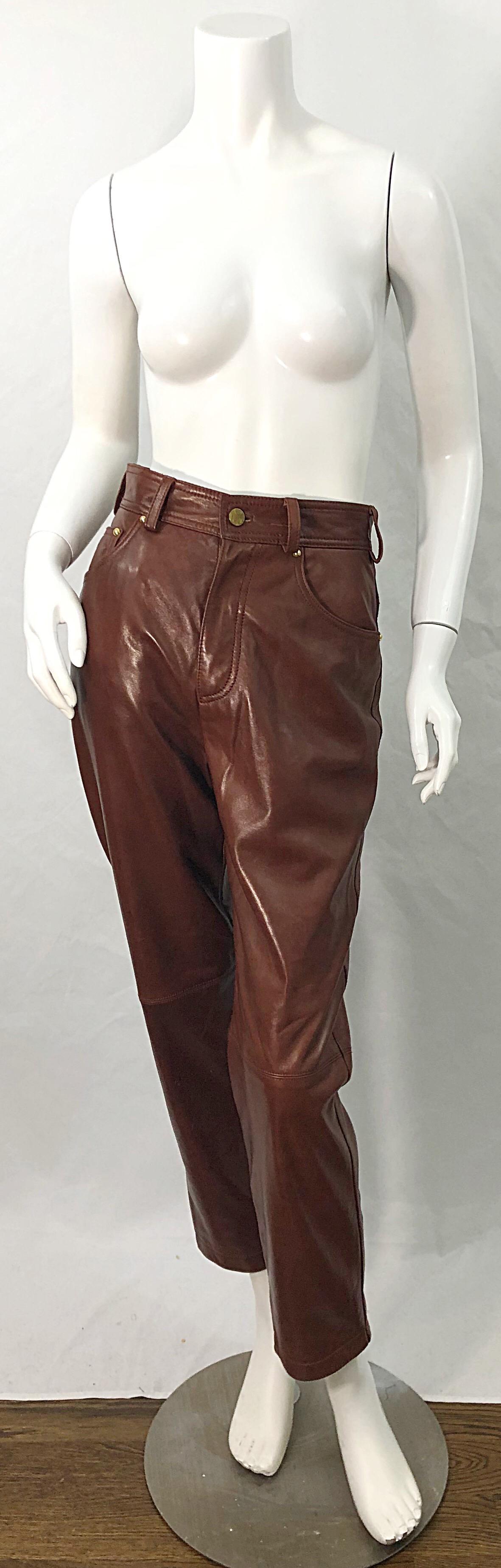 Stylish 90s vintage ESCADA by MARGARETHA LEY caramel brown buttery soft high waisted leather pants / trousers ! Features the perfect color brown that literally matches everything. Button at waist with hidden interior buttons. Zipper fly. Pockets at