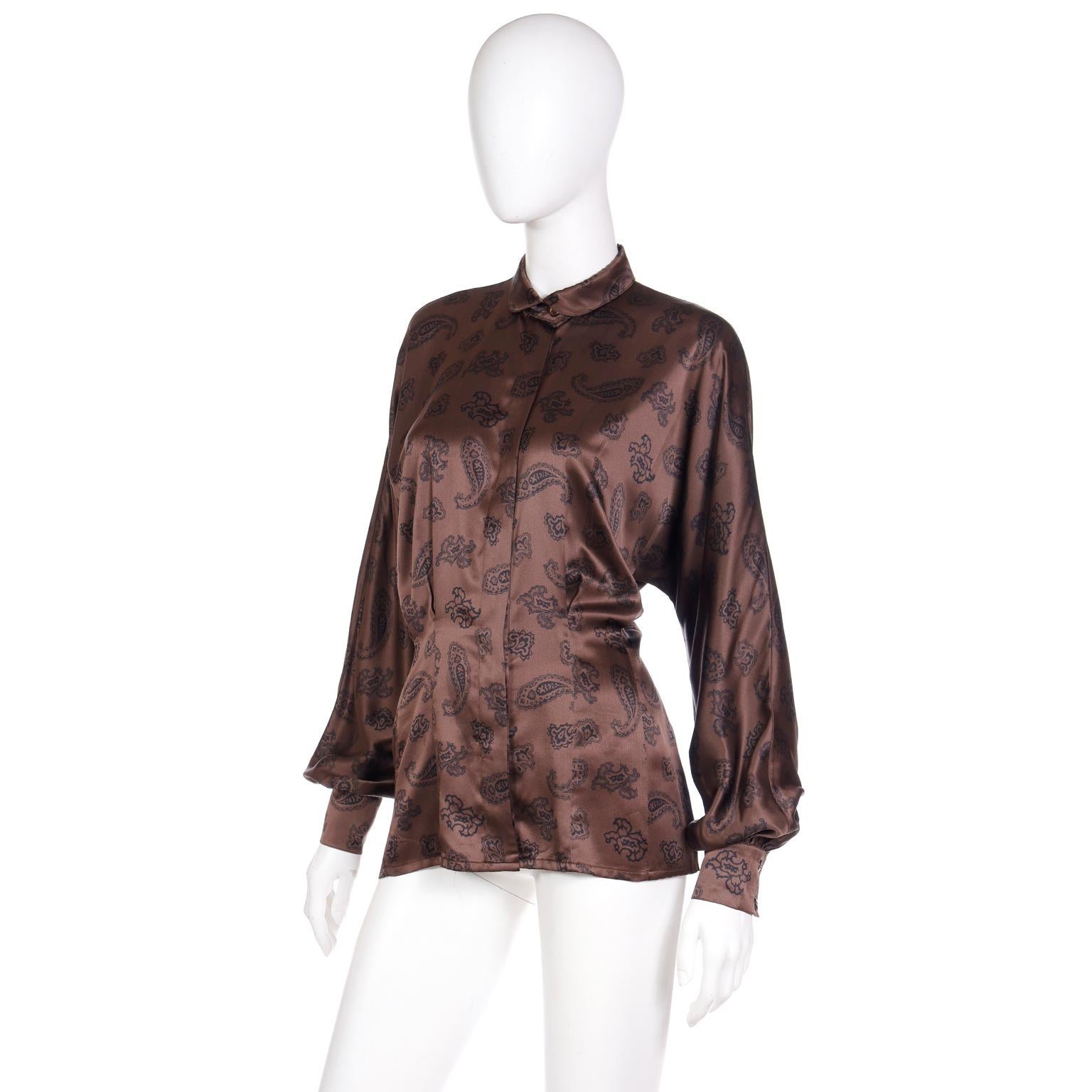 We are passionate about vintage Escada by Margaretha Ley pieces, especially her prints and silk blouses! This beautiful blouse is in a brown and black paisley print with bishop sleeves and a peter pan collar. This lovely 1980's top has darts and