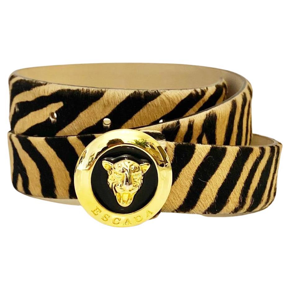 Superb  1980's Escada belt in tiger stripe pony skin, lined with neutral leather and finished with a gold and enamel leopard charm buckle, gold-tone metalware, Made in Italy This stunning belt adds a luxurious and sophisticated edge to any outfit,