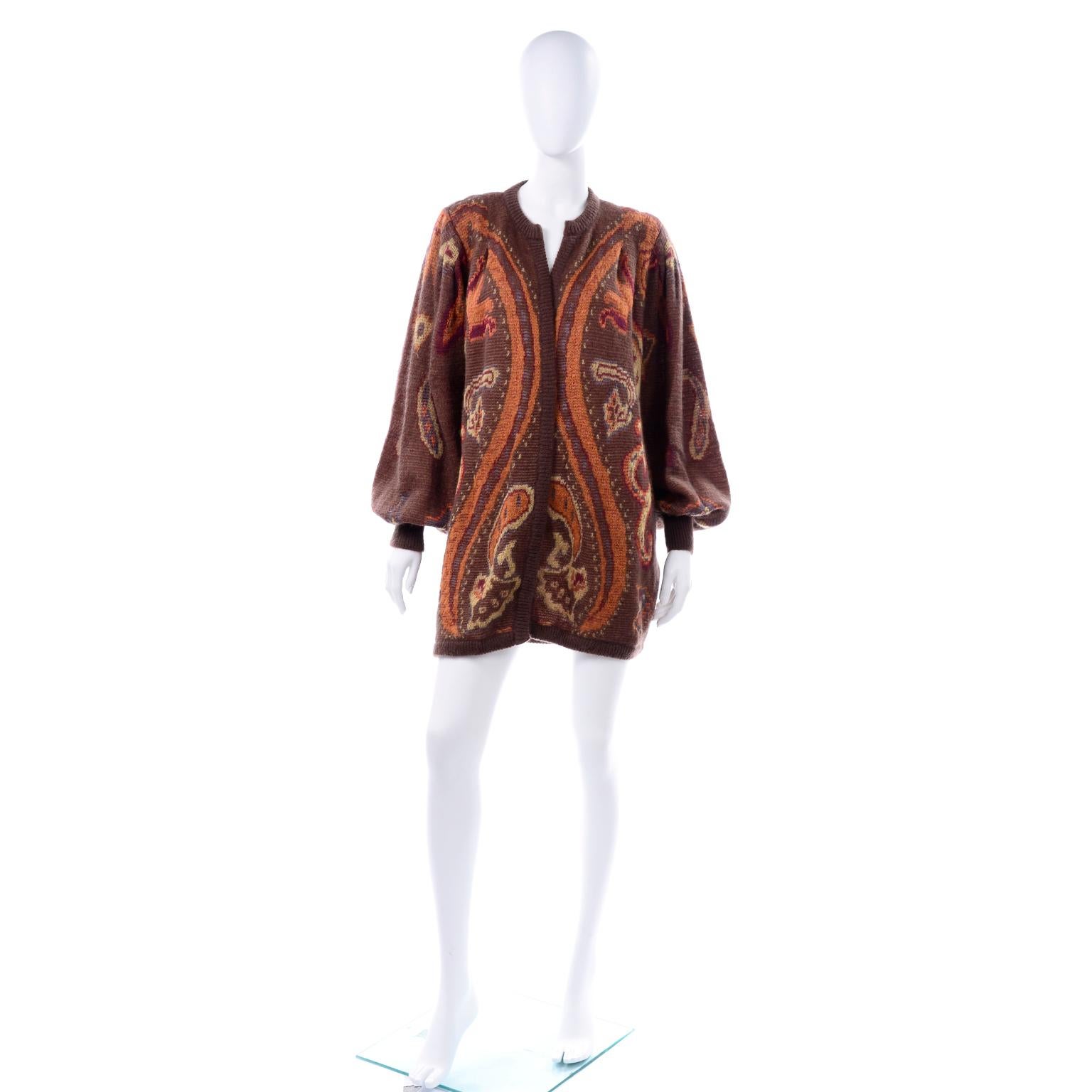 We love oversized sweaters and this vintage Escada paisley wool and mohair open cardigan sweater is one of our favorites for this Fall. There are no buttons or closures and the balloon sleeves are pleated at the shoulders for additional volume. This