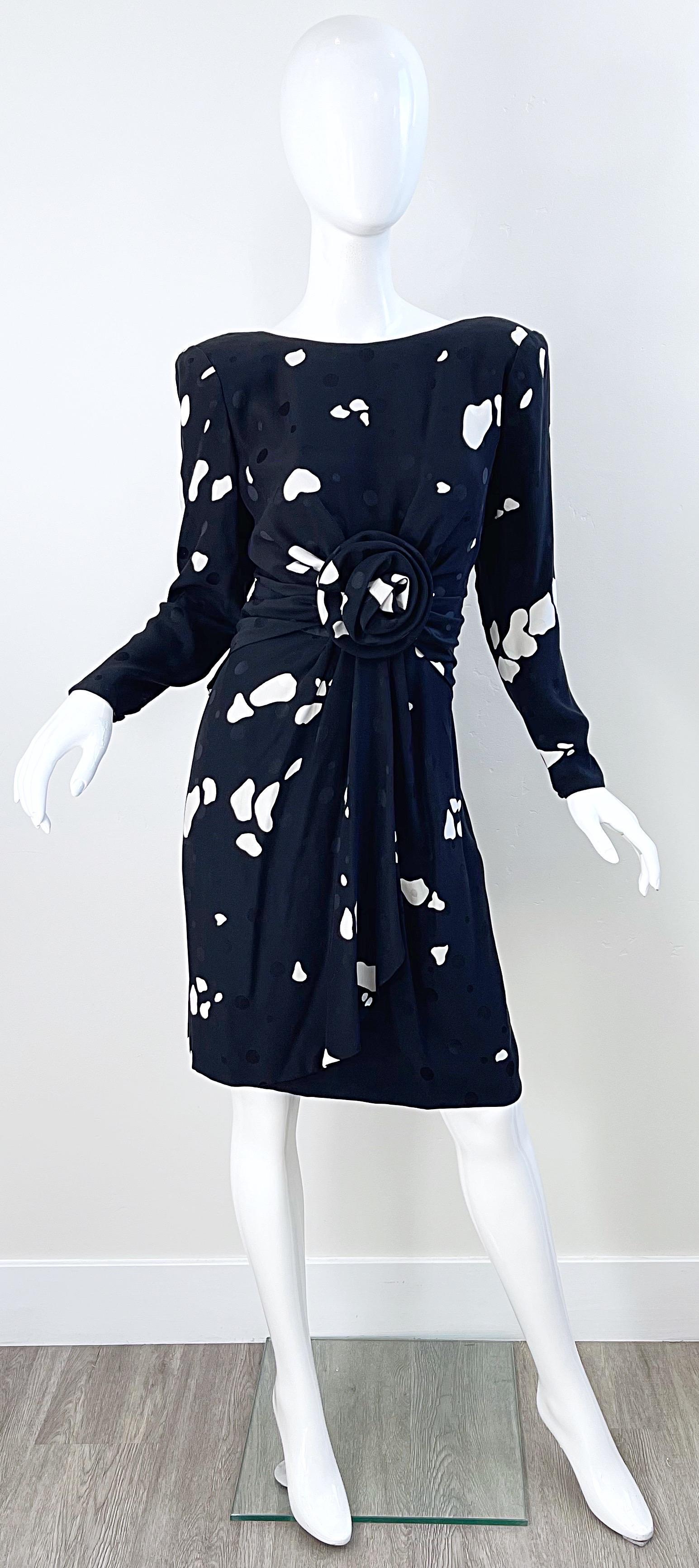 Amazing 1980s ESTEVEZ black and white abstract print long sleeve silk dress ! Features a flowerette at center waist. Inner shoulder pads attached. Hidden zipper up the back with buttons and hook-and-eye closure. Hidden zippers at each sleeve cuff.