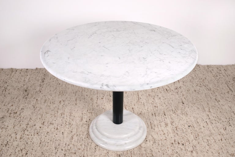 White Carrara marble top and base Ettore Sottsass attributed pedestal dining table. Beautiful and whimsical, this piece exemplifies the Memphis Milano esthetic created by Ettore Sottsass. What would go on to represent one of the most collectable