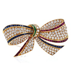 1980s, Exceptional Large Diamond Multi Gem 18k Gold Bow Pin Brooch